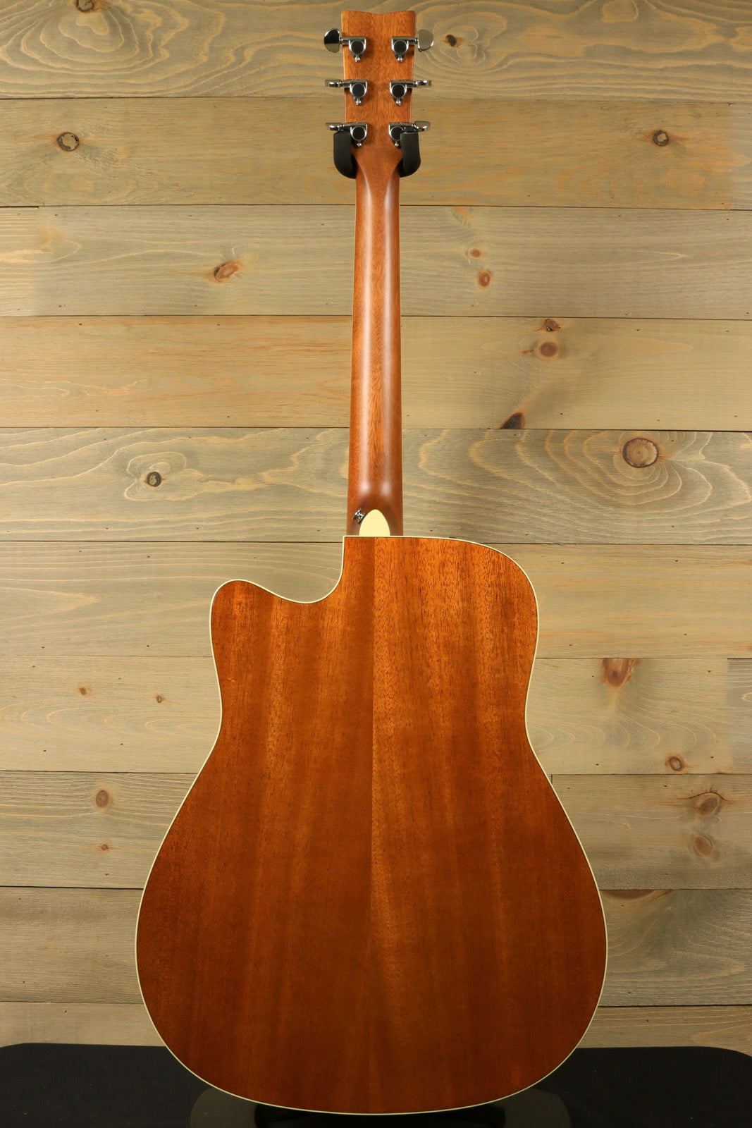 Yamaha acoustic electric guitar natural finish, back view showcasing smooth wood grain