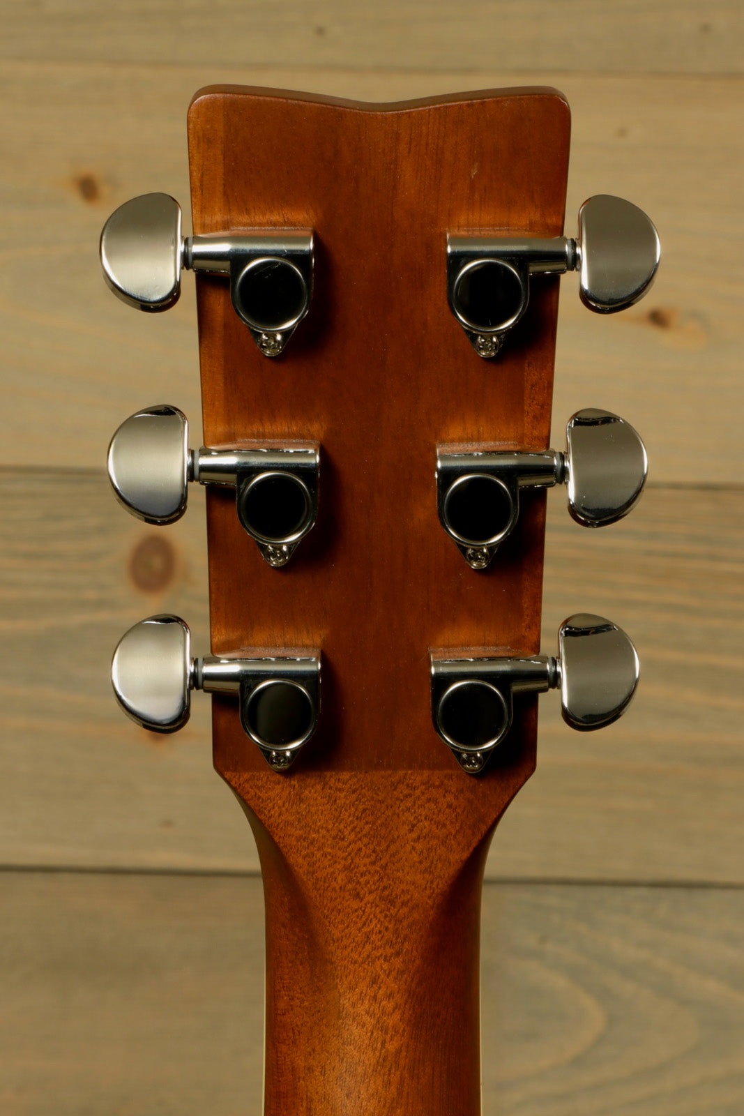 Yamaha acoustic electric guitar neck, back view with chrome tuning pegs and natural wood finish