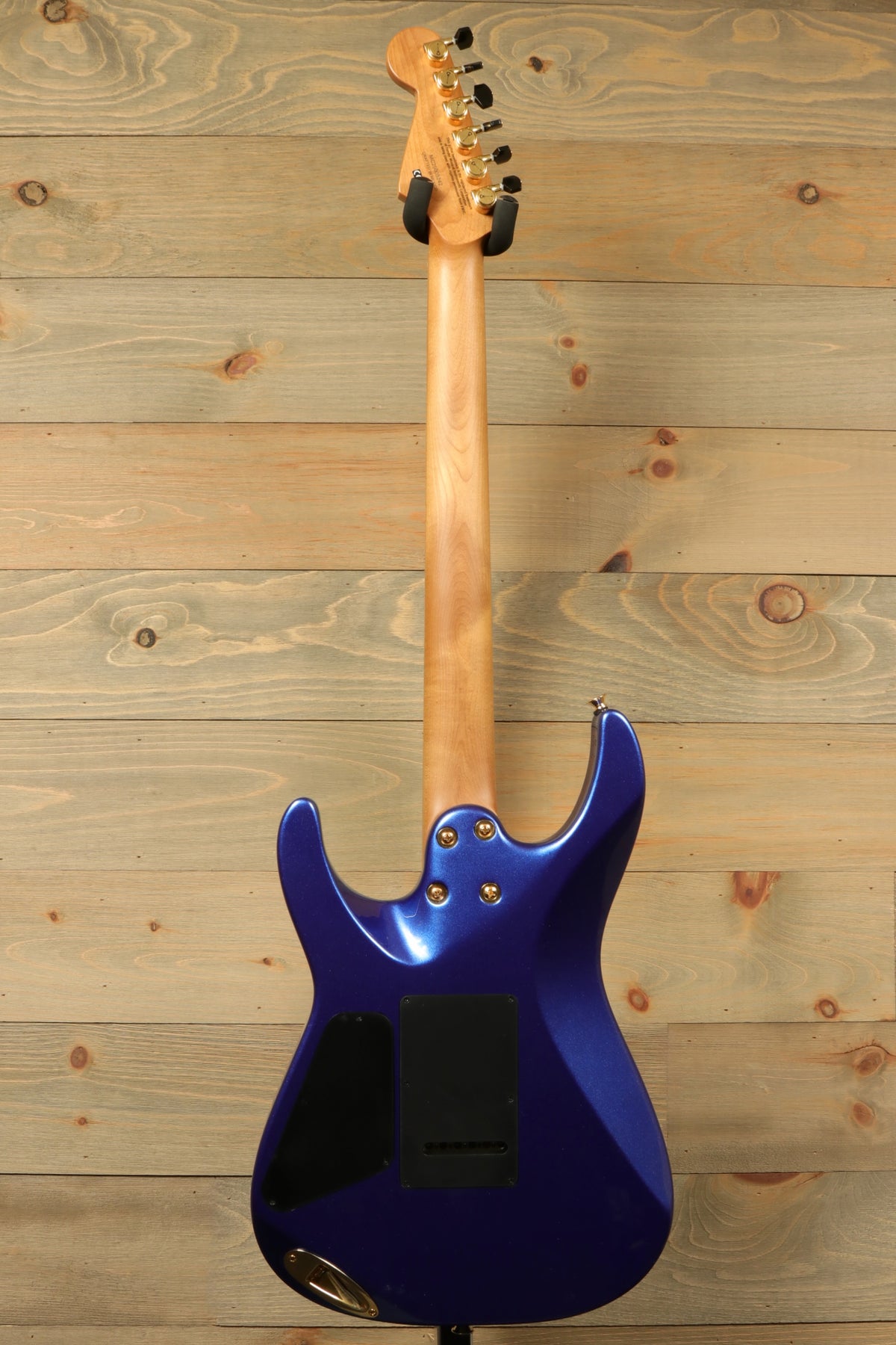 Charvel Pro-Mod DK24 HSH electric guitar in blue, back view showing neck and body design