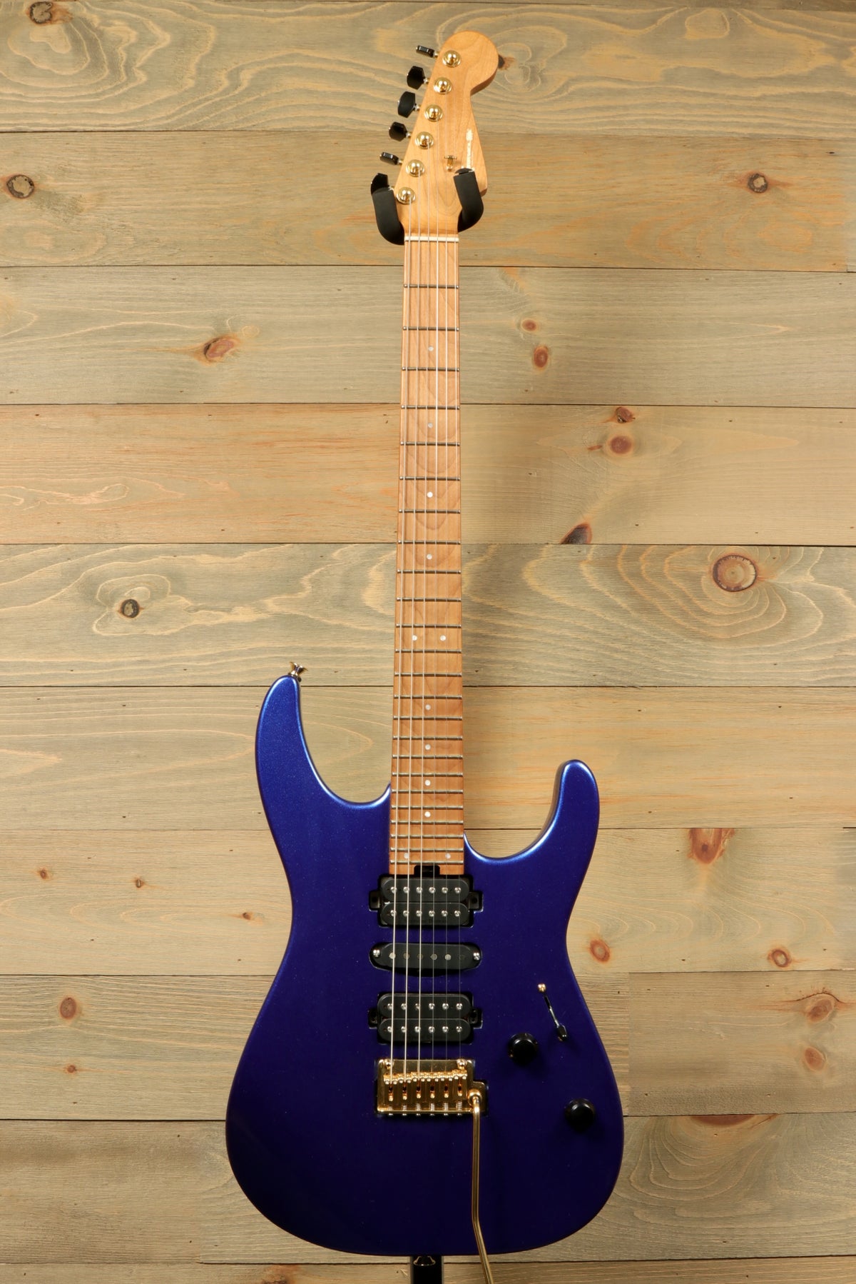 Charvel Pro-Mod DK24 HSH electric guitar in blue, front view with maple neck and black pickups