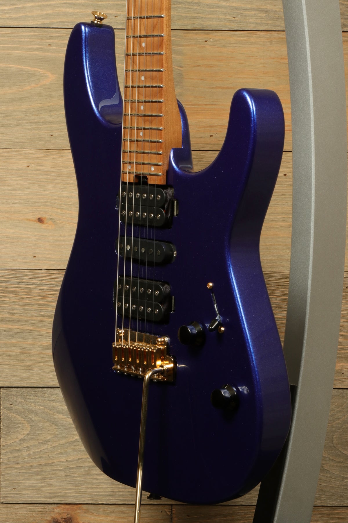 Charvel Pro-Mod DK24 HSH in blue metallic finish, side view highlighting the sleek body and hardware
