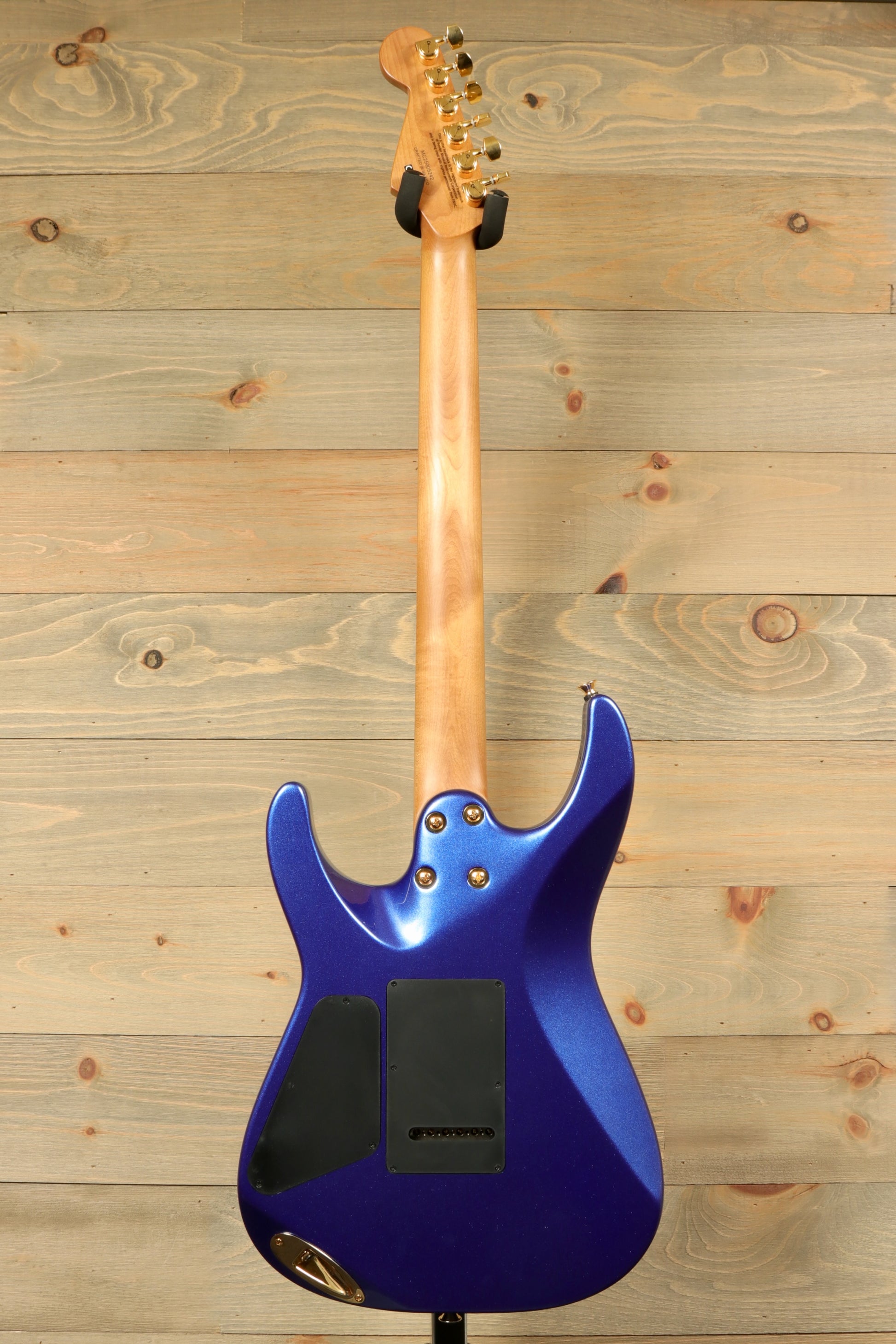 Back view of the Charvel Pro-Mod DK24 Mystic Blue guitar highlighting its sleek design and smooth finish