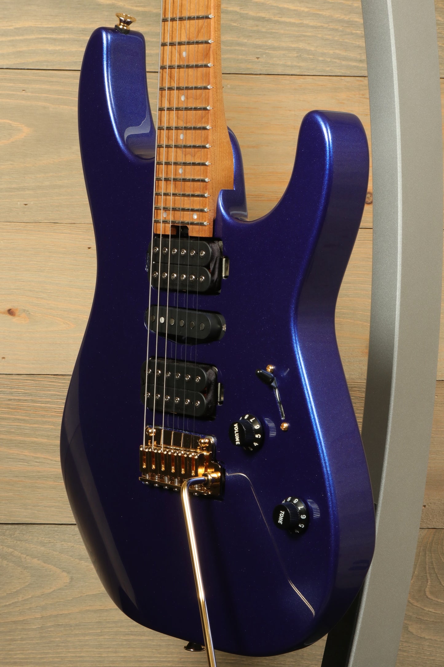 Charvel Pro-Mod DK24 Mystic Blue guitar with sleek body and gold hardware for electric music enthusiasts
