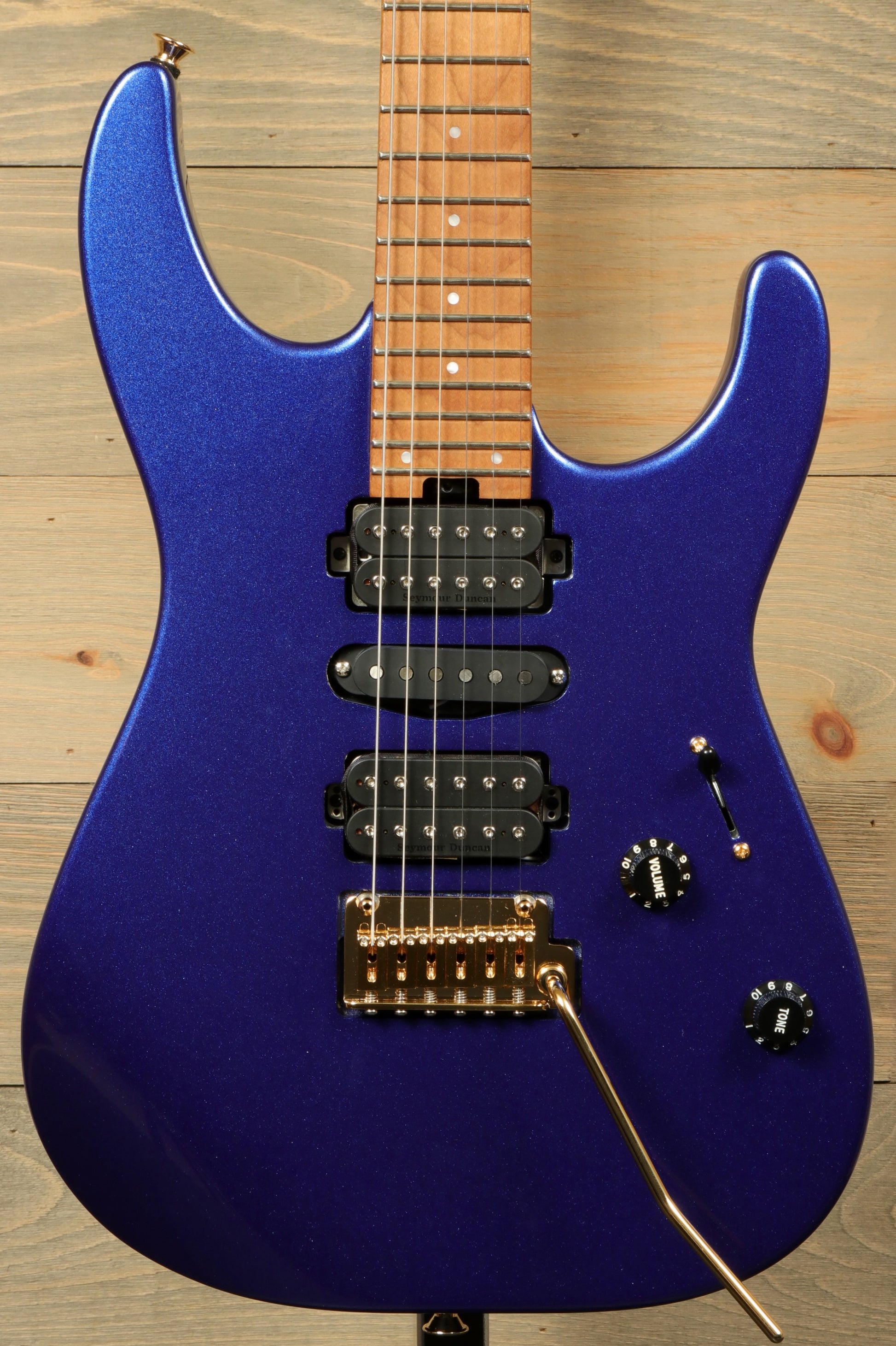 Charvel Pro-Mod DK24 Mystic Blue guitar with sleek design and three pickups