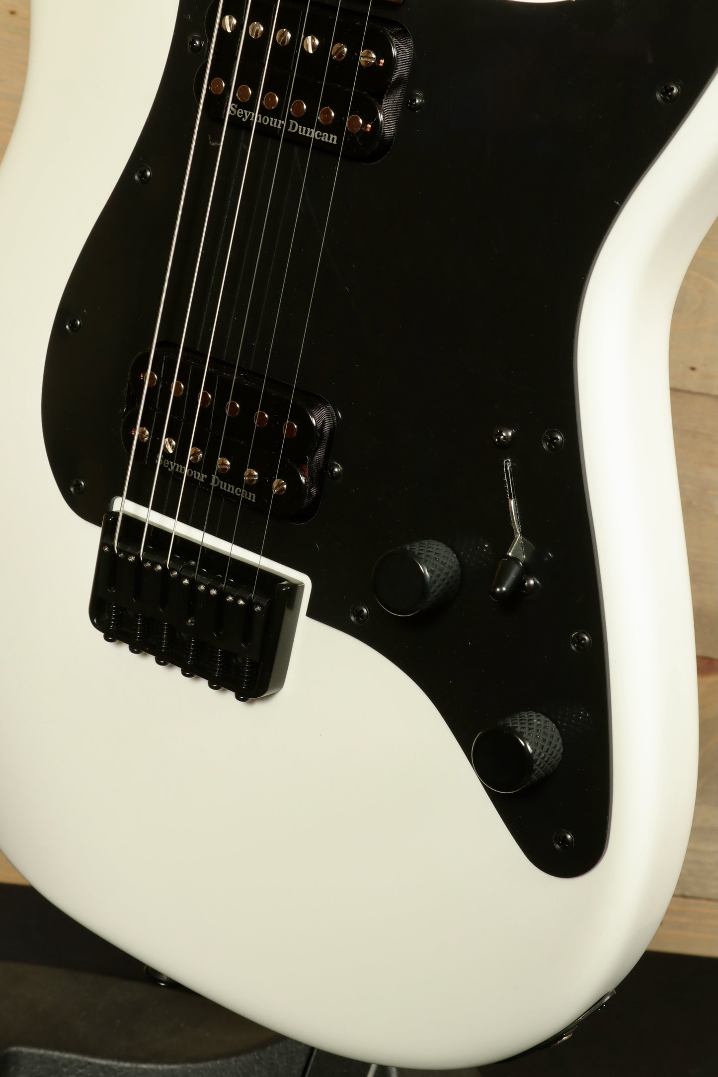Charvel Pro-Mod So-Cal electric guitar with sleek white finish and black hardware