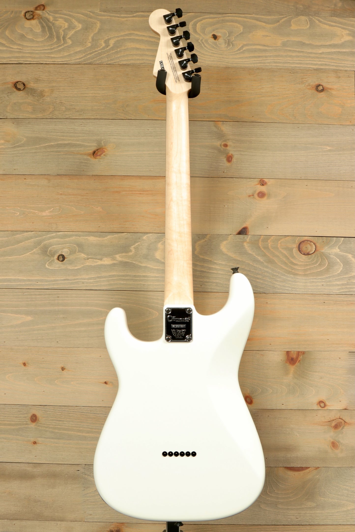 Back view of Charvel Pro-Mod So-Cal electric guitar with sleek white finish and maple neck