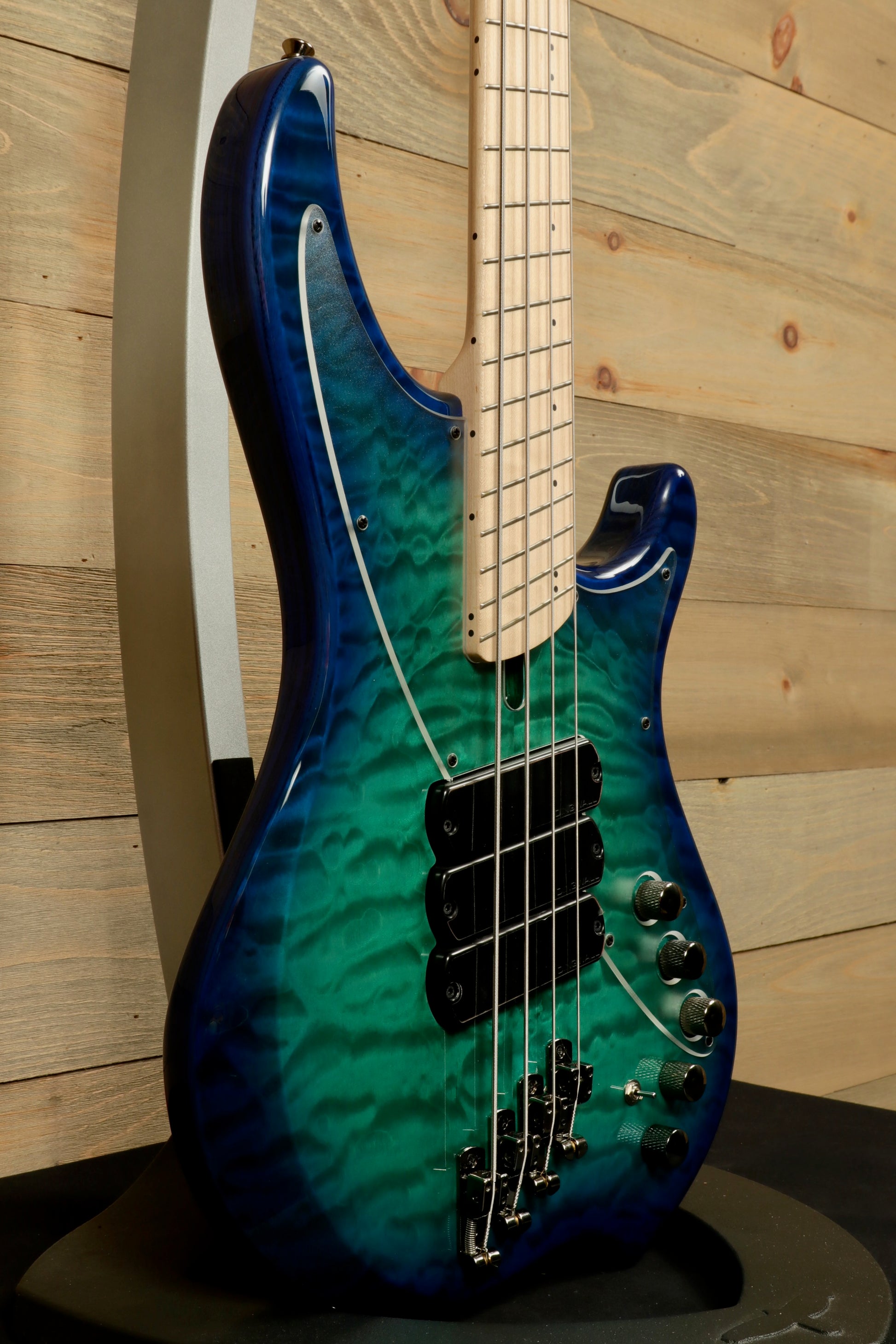 Dingwall Combustion Nashville teal and blue burst finish, side view with visible strings and controls