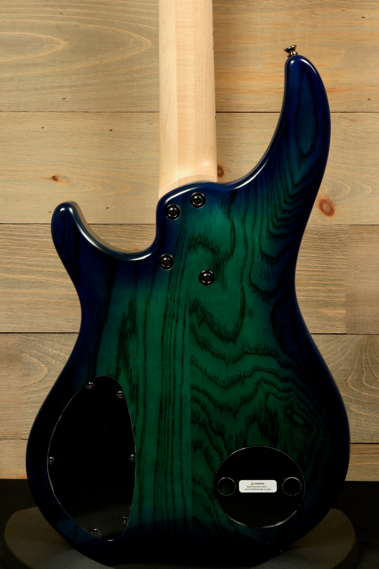 Dingwall Combustion Nashville bass guitar in green and blue finish, back view showcasing wood grain