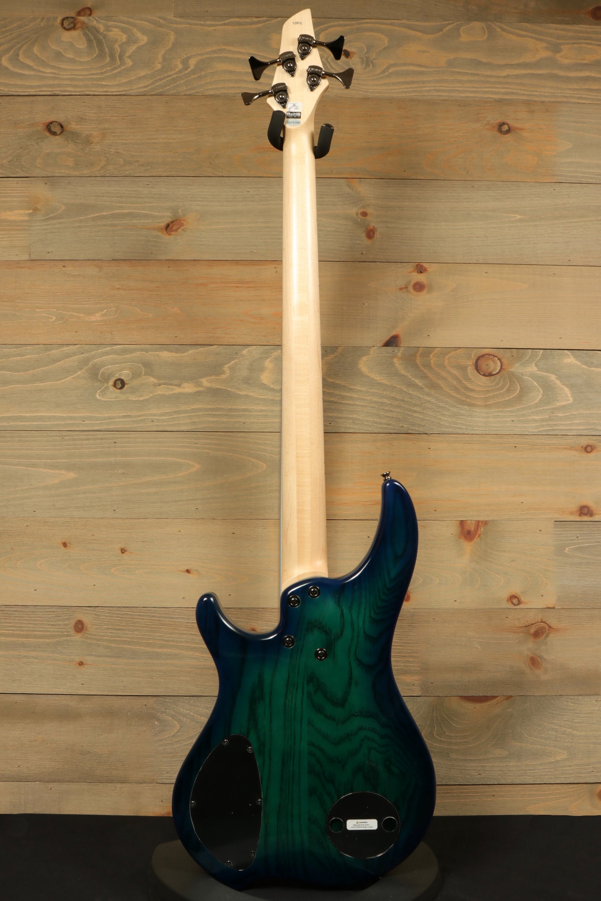 Dingwall Combustion Nashville bass guitar with a blue-green finish, rear view showcasing the neck and body