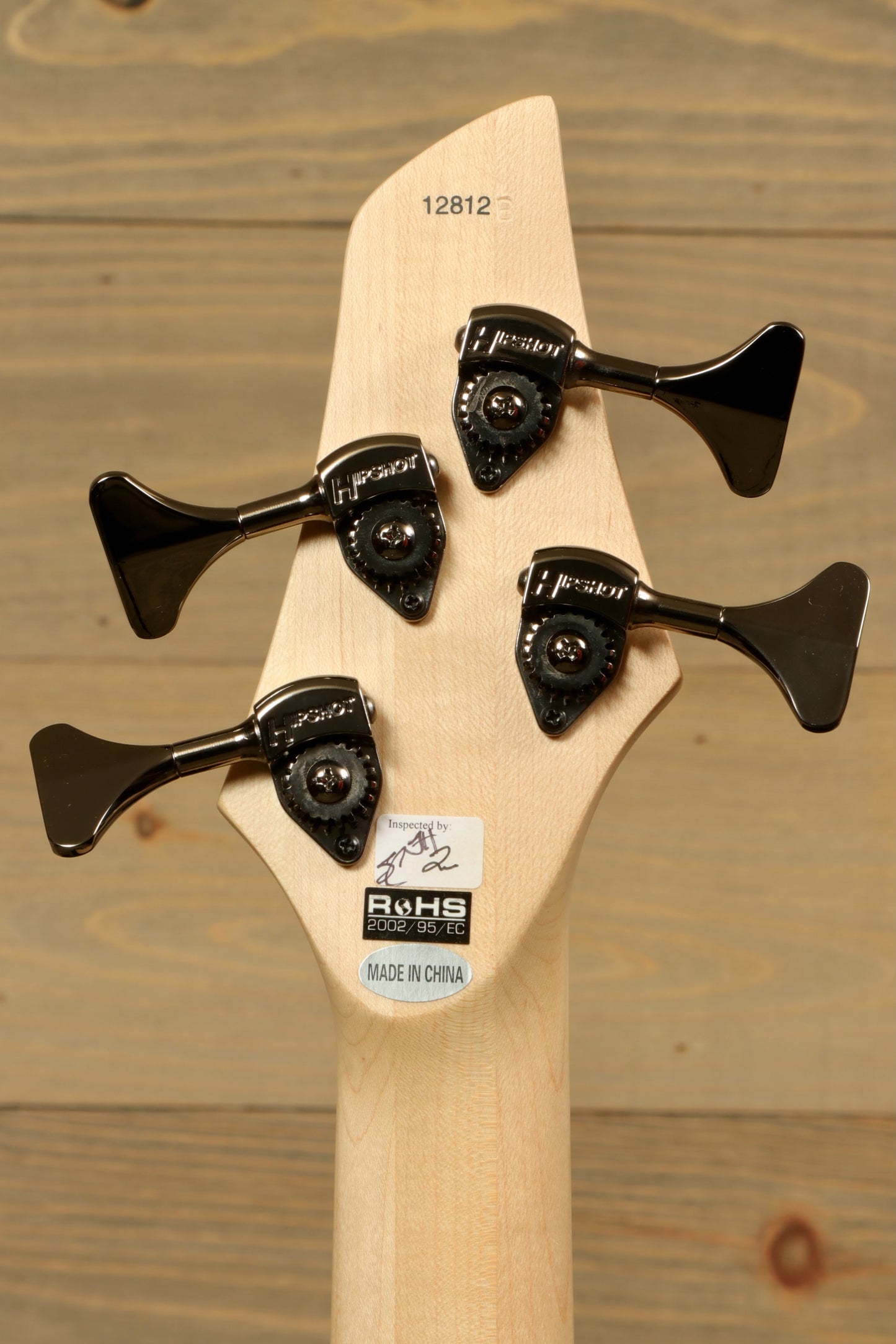 Dingwall Combustion Nashville bass guitar headstock with three tuning pegs, natural finish