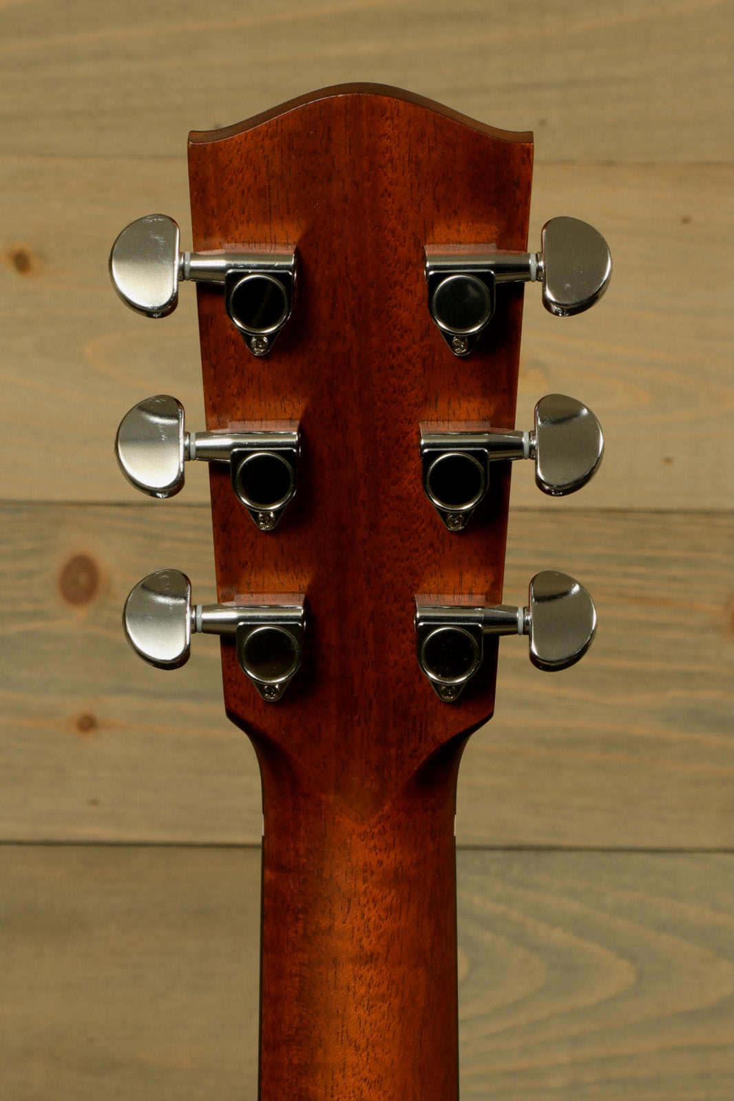 Eastman AC122-1CE acoustic electric guitar headstock in natural finish, back view showing tuning pegs