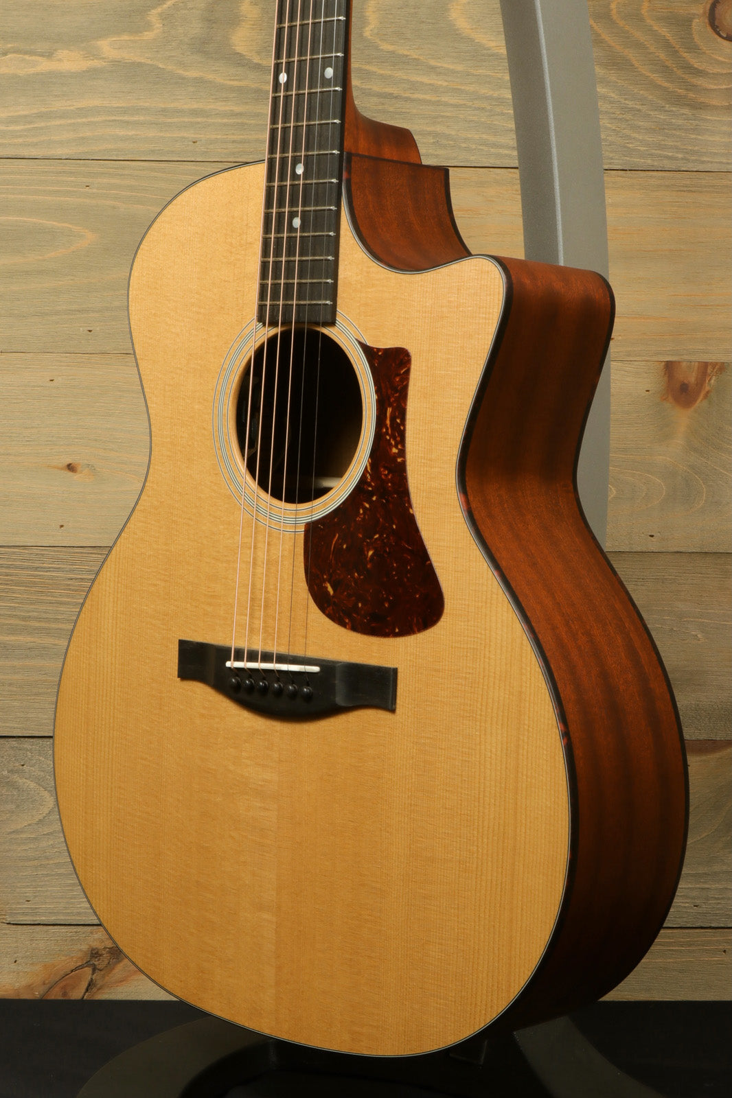 Eastman AC122-1CE acoustic electric guitar, natural finish, side view showcasing body shape and wood grain