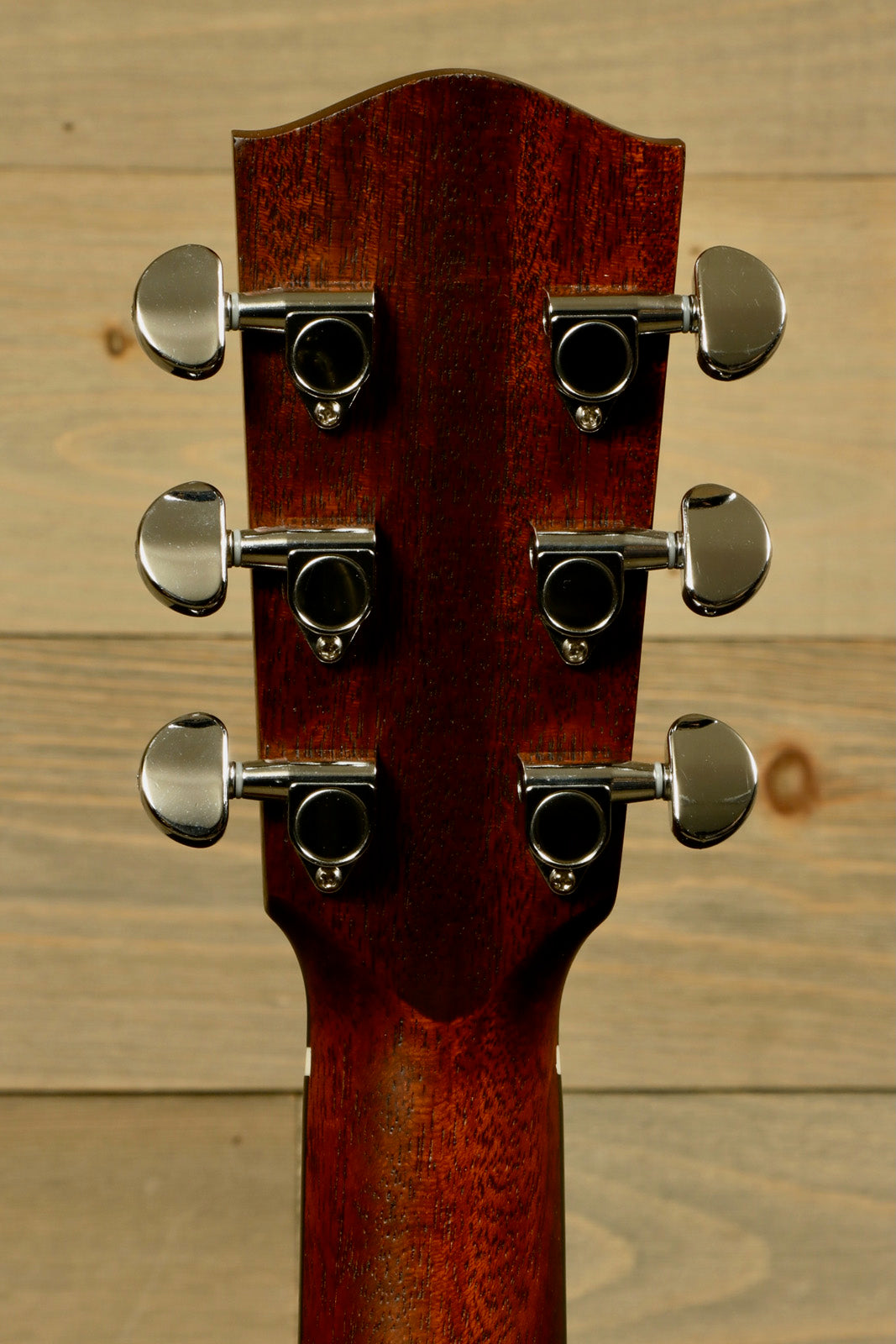Eastman AC122L-1CE acoustic electric guitar, back view showcasing tuning pegs and mahogany neck