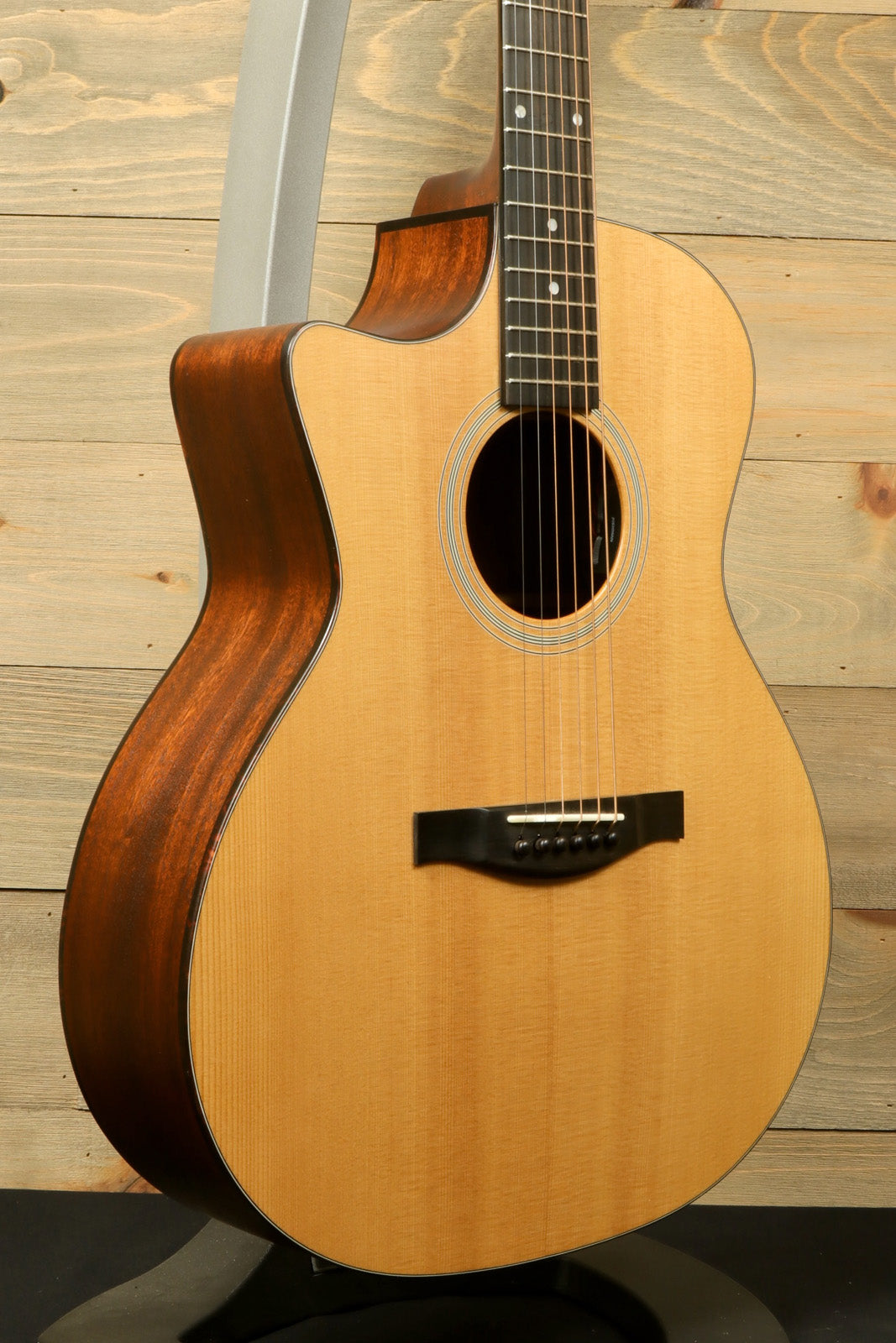 Eastman AC122L-1CE acoustic electric guitar, natural finish, front view highlighting the solid wood body