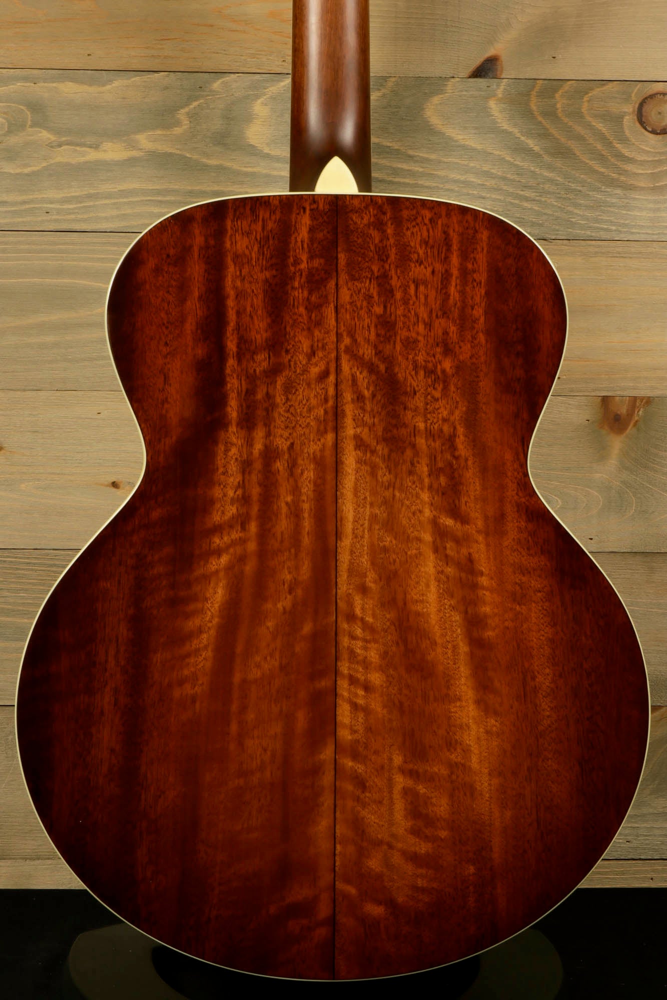 Back view of Eastman AC330E-12 12-string acoustic guitar showcasing its beautiful wood grain finish