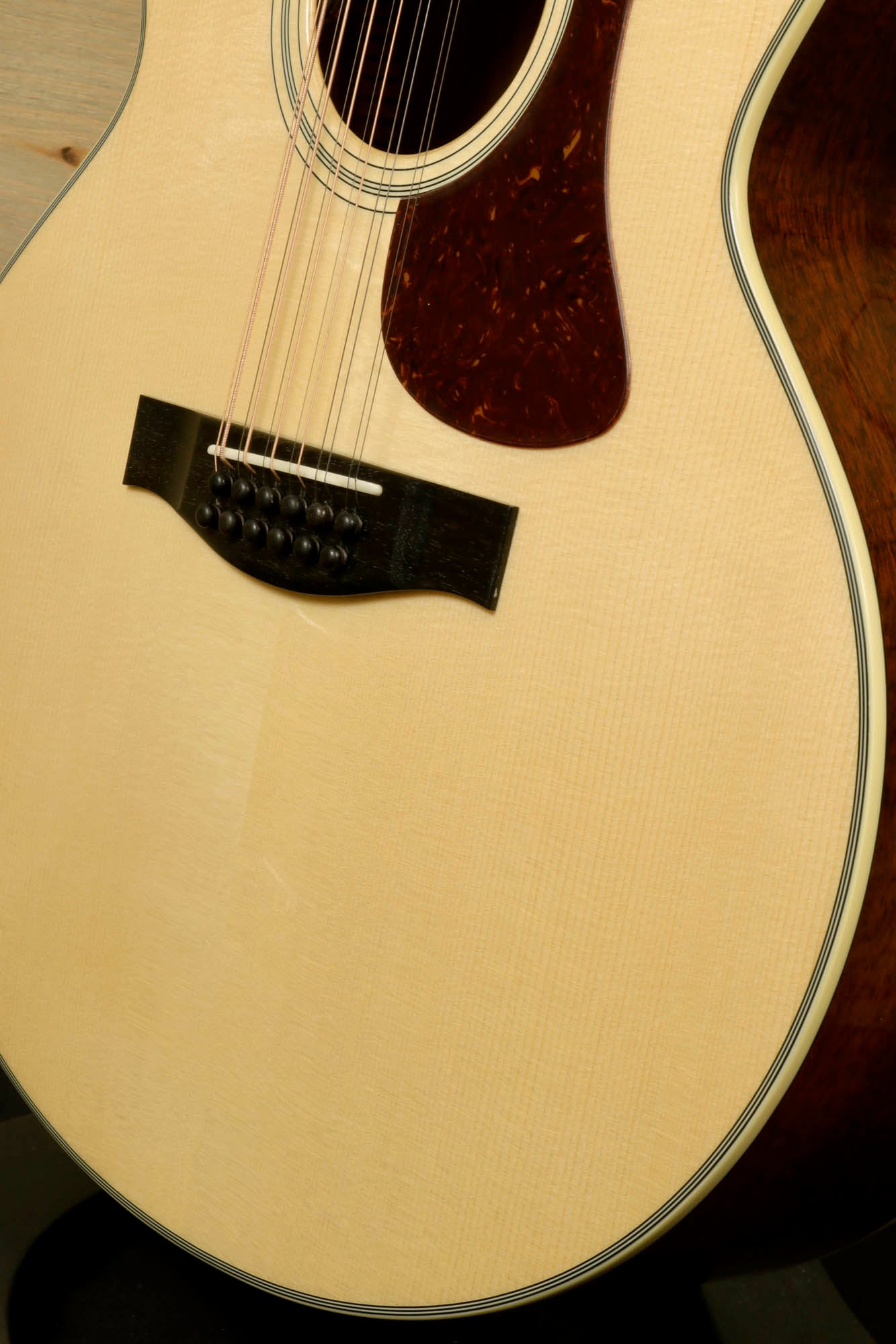 Eastman AC330E-12 12-string acoustic guitar featuring a polished spruce top and elegant rosewood accents