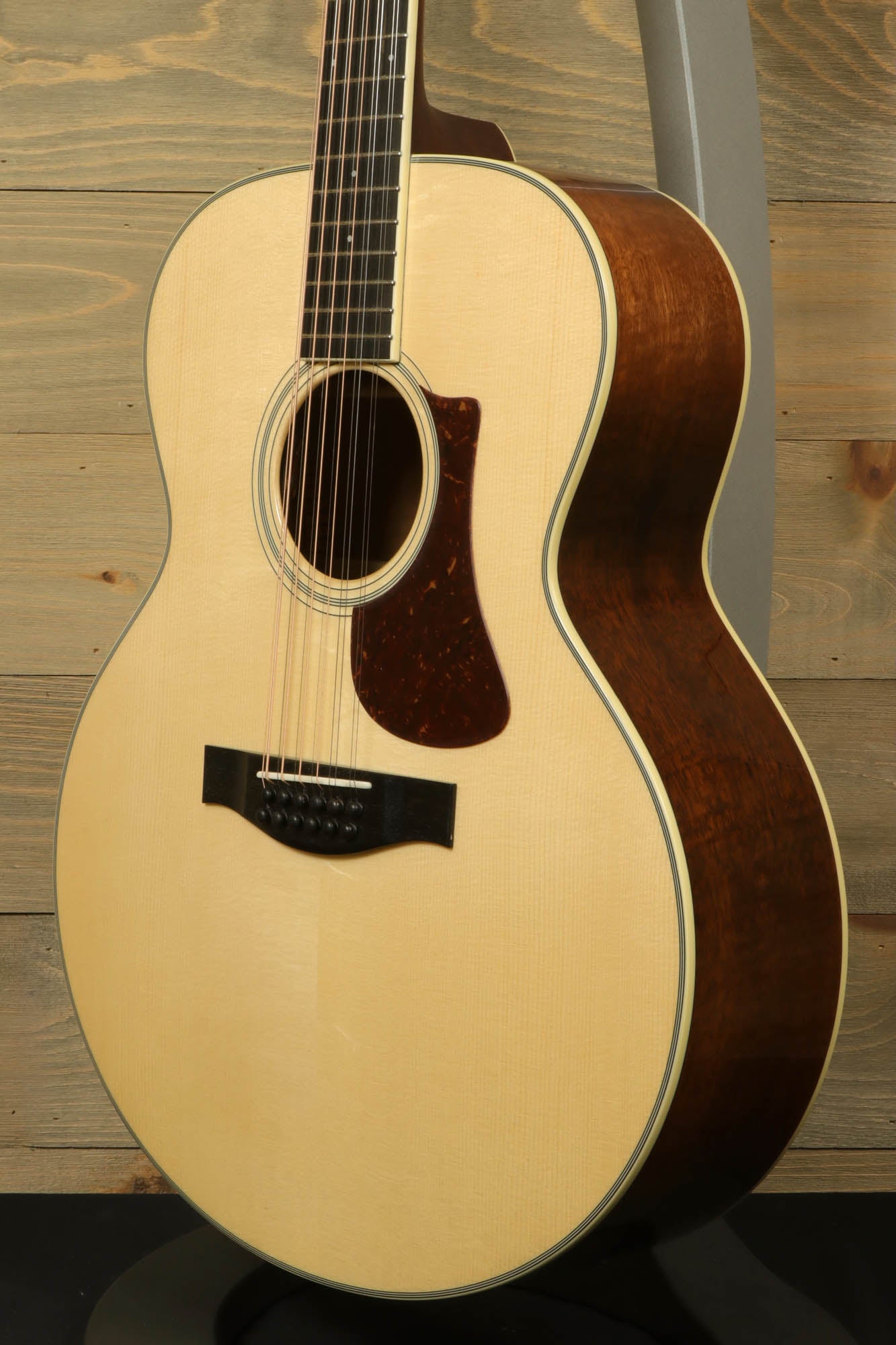 Eastman AC330E-12 12-string acoustic guitar showcasing a natural wood finish and elegant design