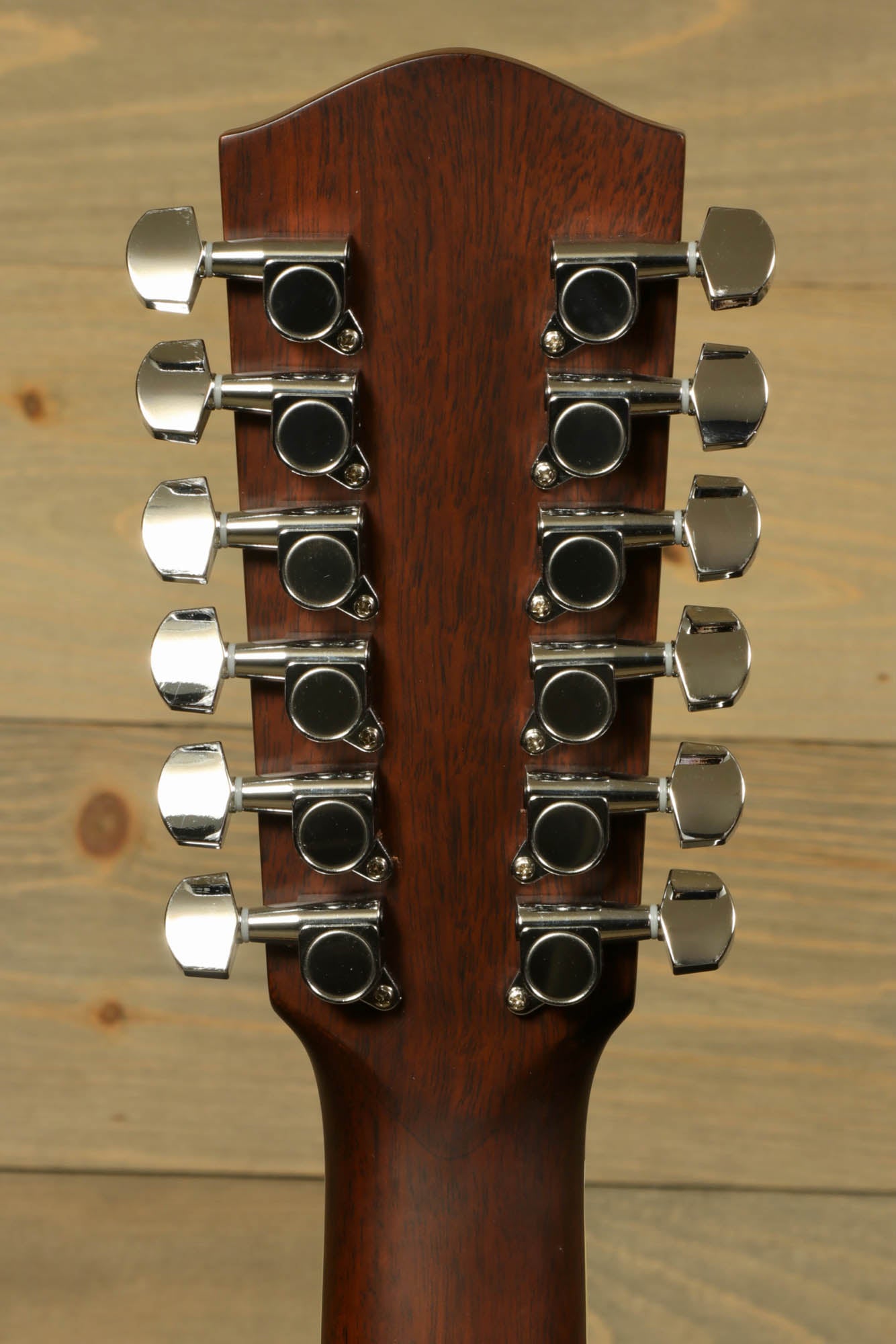 Back of Eastman AC330E-12 12-string acoustic guitar showcasing tuning pegs for precise tuning