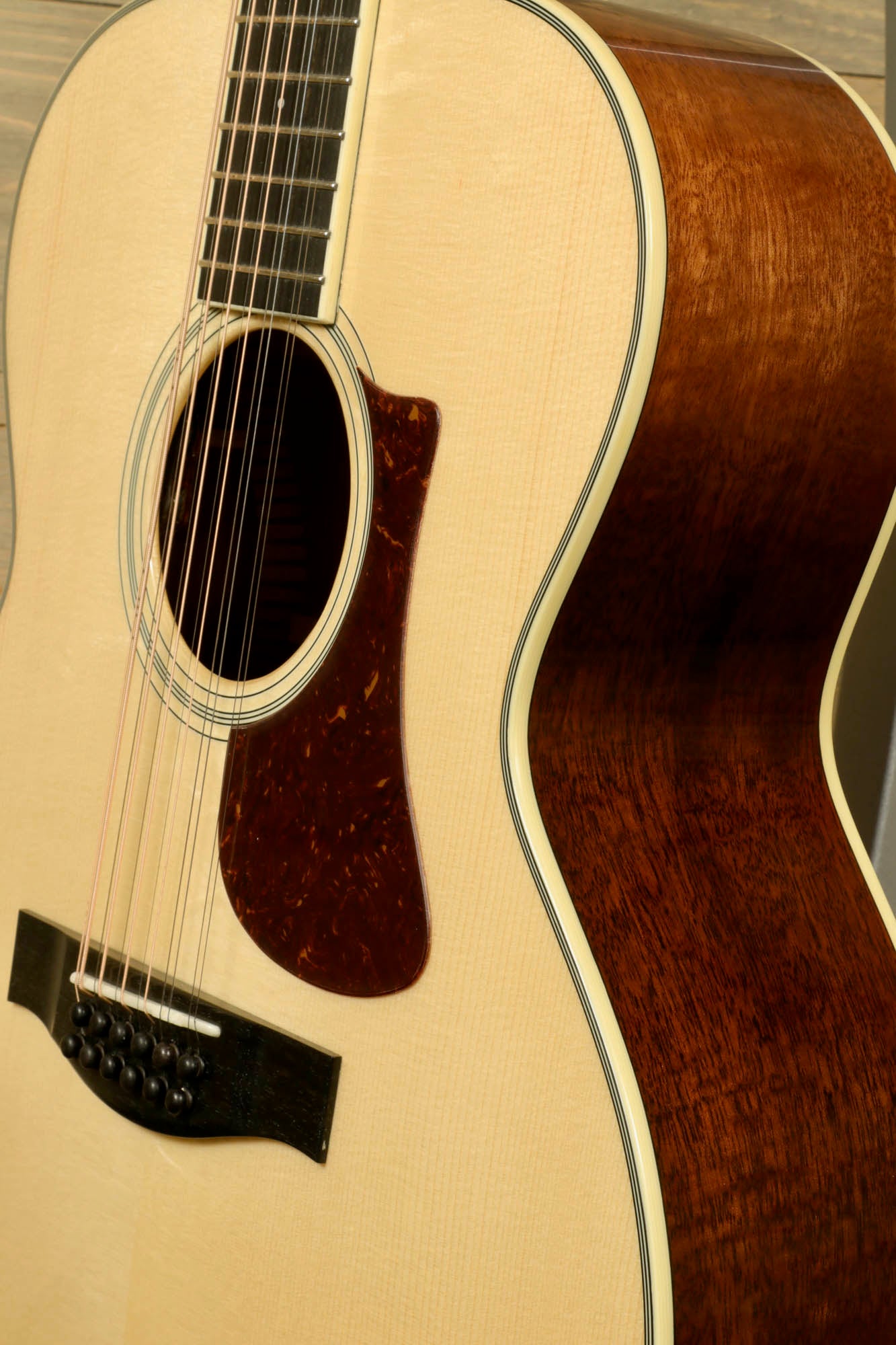 Eastman AC330E-12 12-string acoustic guitar with a natural finish and elegant detailing