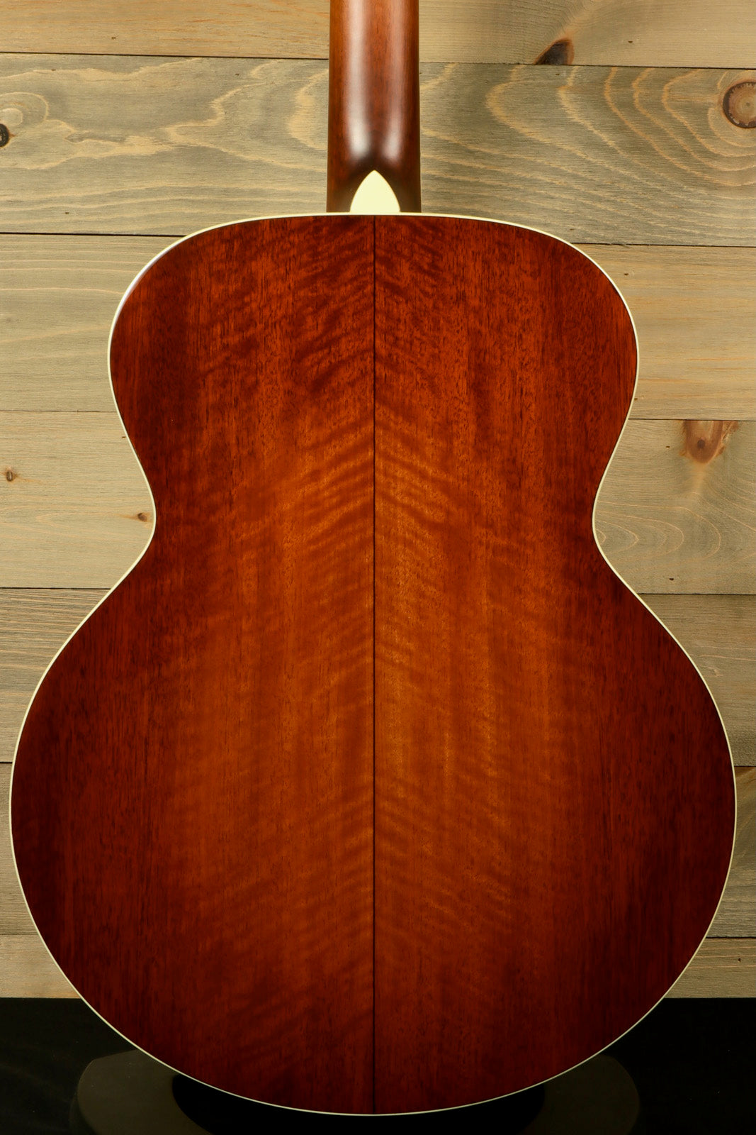 Back view of Eastman AC330E-12-SB 12-string acoustic guitar showing its beautiful wood grain finish