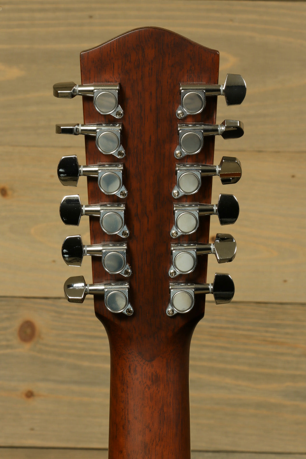 Back view of Eastman AC330E-12-SB 12-string acoustic guitar featuring 12 tuning pegs and a rich wood finish