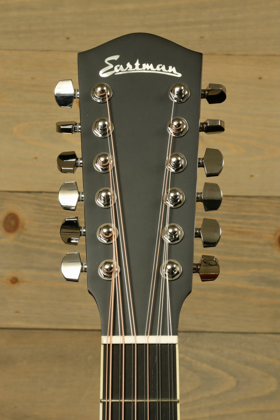 Eastman AC330E-12-SB 12-string acoustic guitar headstock with polished tuning pegs