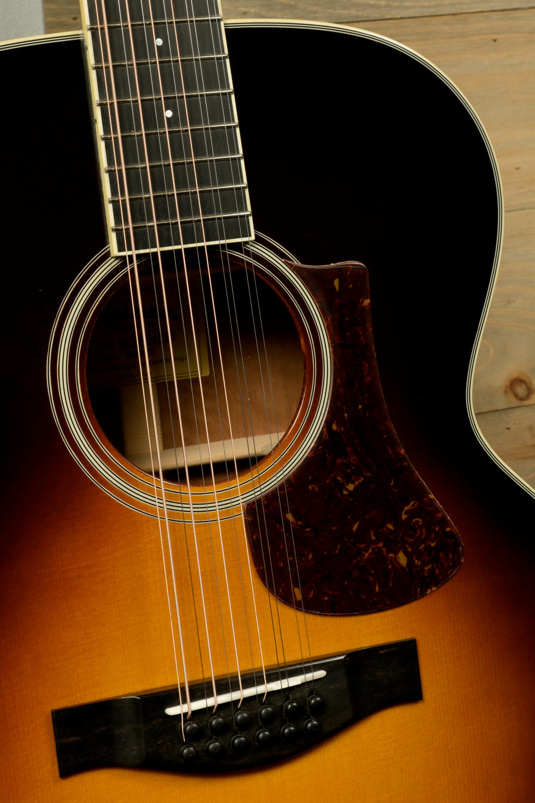 Eastman AC330E-12-SB 12-string acoustic guitar with a beautiful sunburst finish and intricate detailing