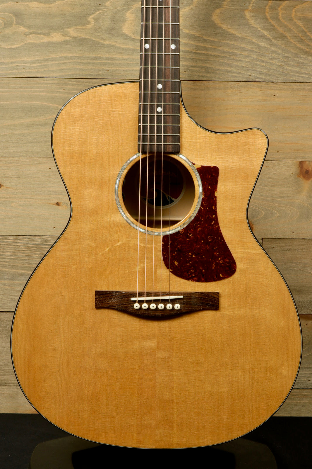 Eastman acoustic guitar, natural finish, front view showcasing the body and sound hole.