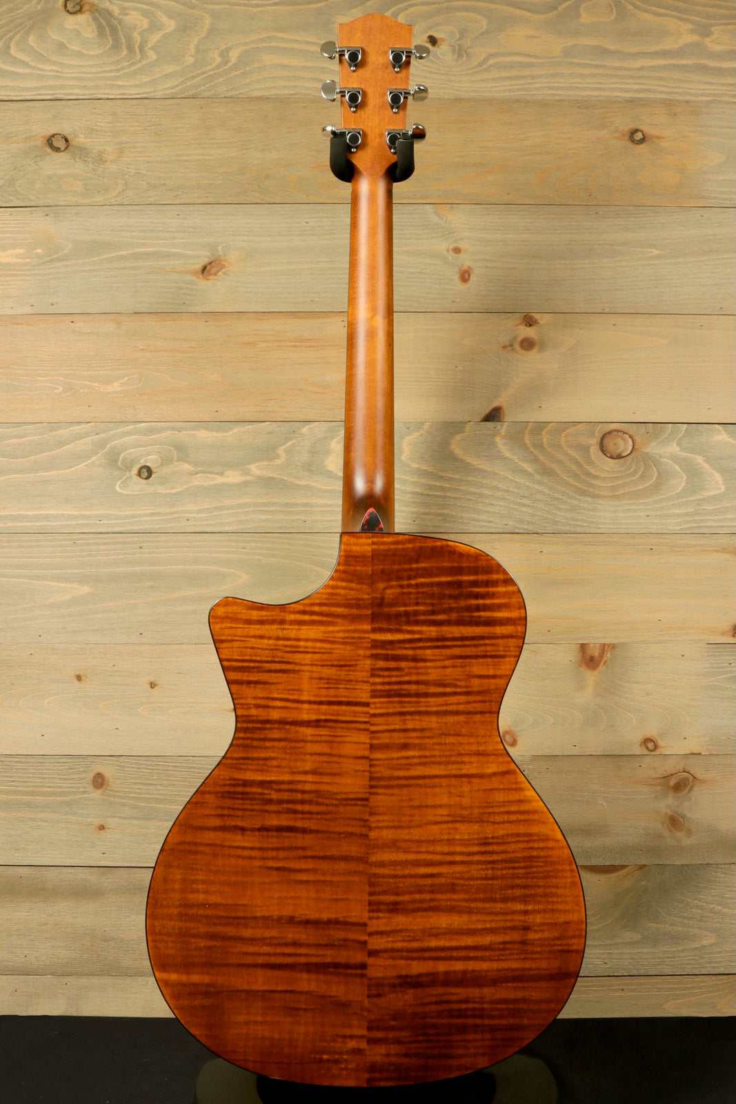 Eastman Acoustic Guitar back view with a beautiful mahogany finish and unique wood grain pattern