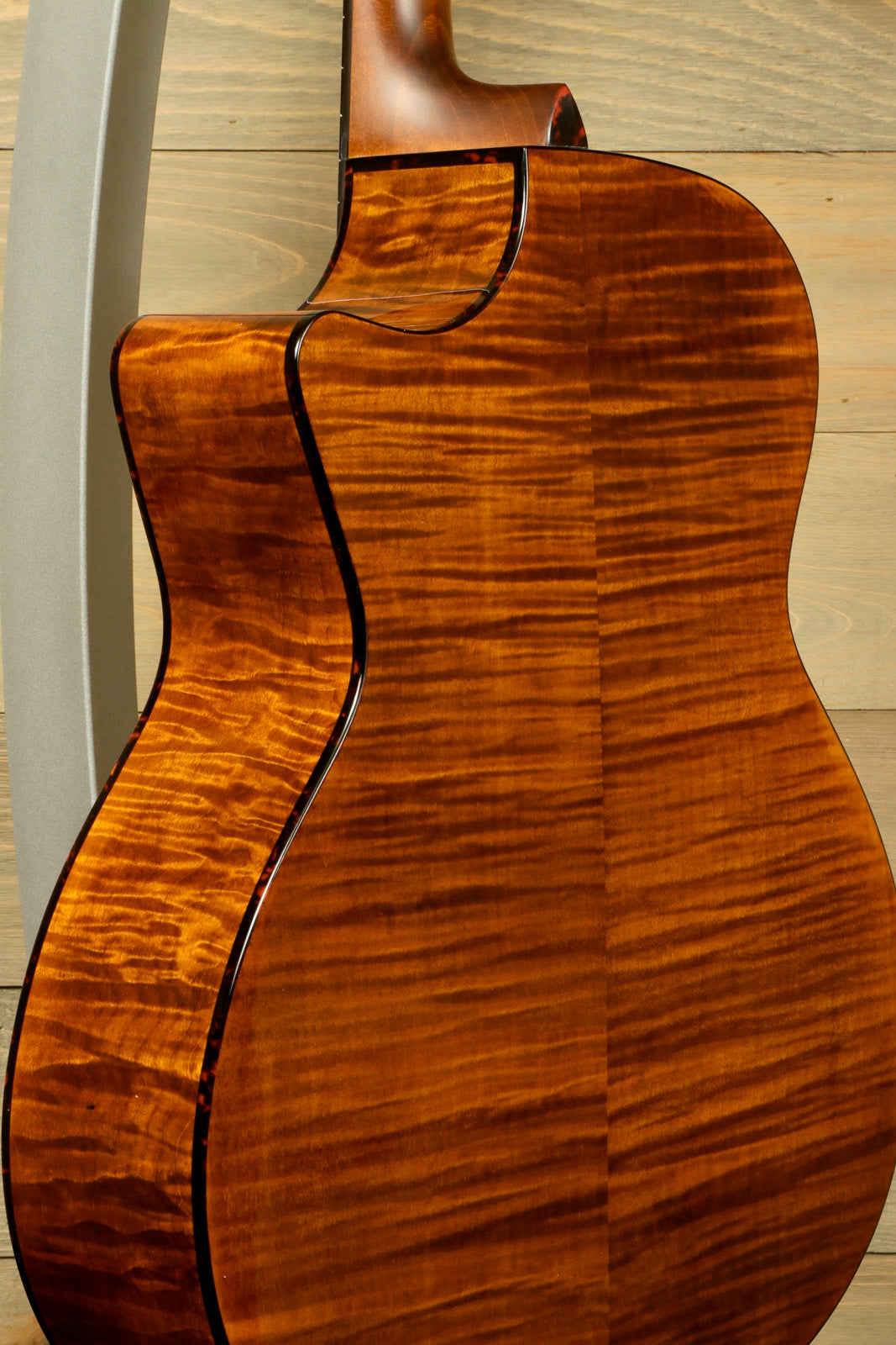 Eastman acoustic guitar with beautiful flamed maple back and sides, side view