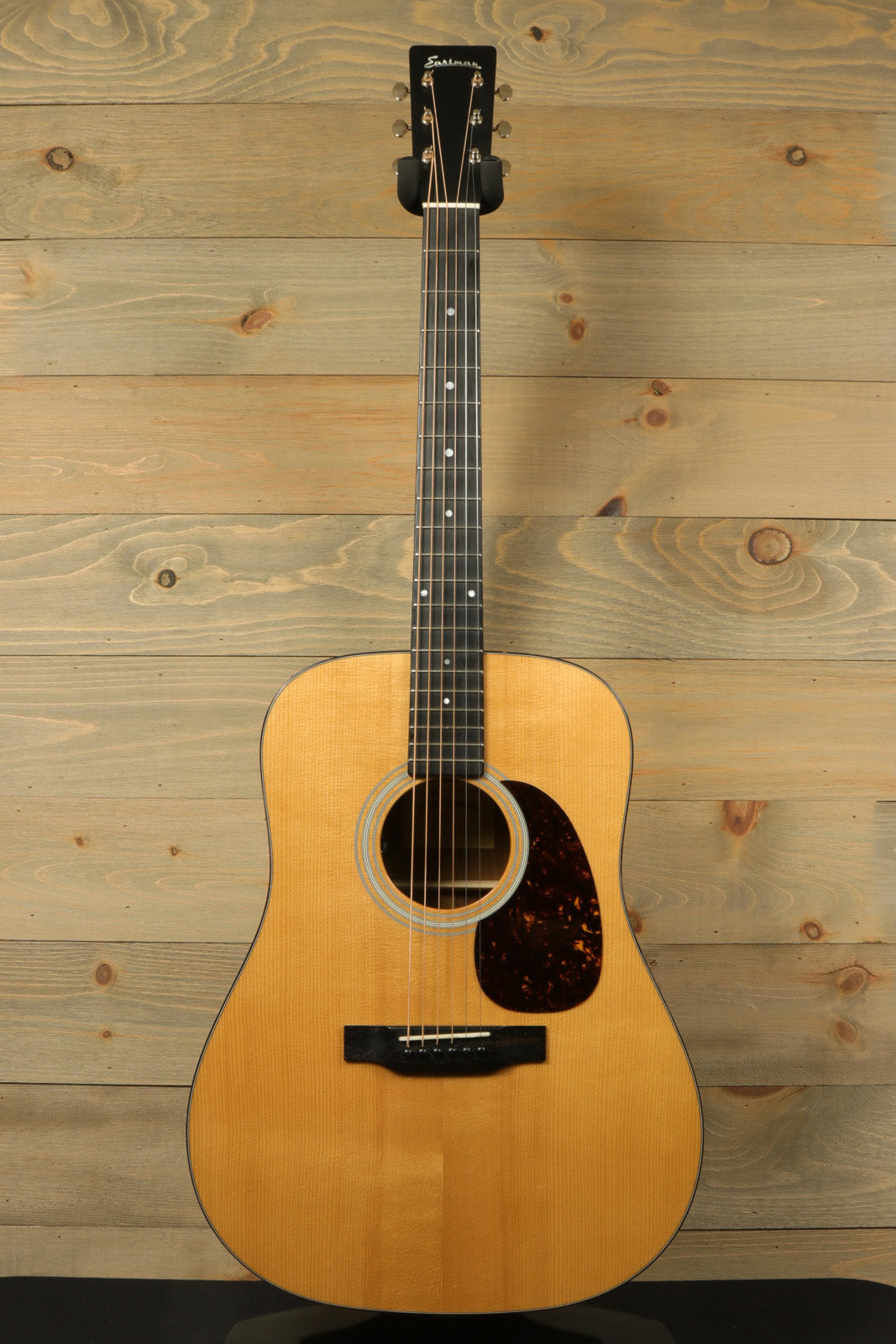 Eastman E10D-TC natural finish acoustic electric guitar, front view with classic design.