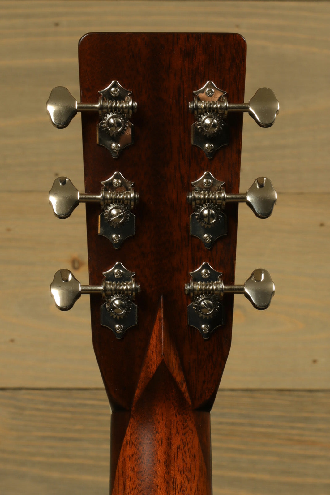 Eastman E10D-TC acoustic electric guitar headstock with six tuning pegs, natural wood finish