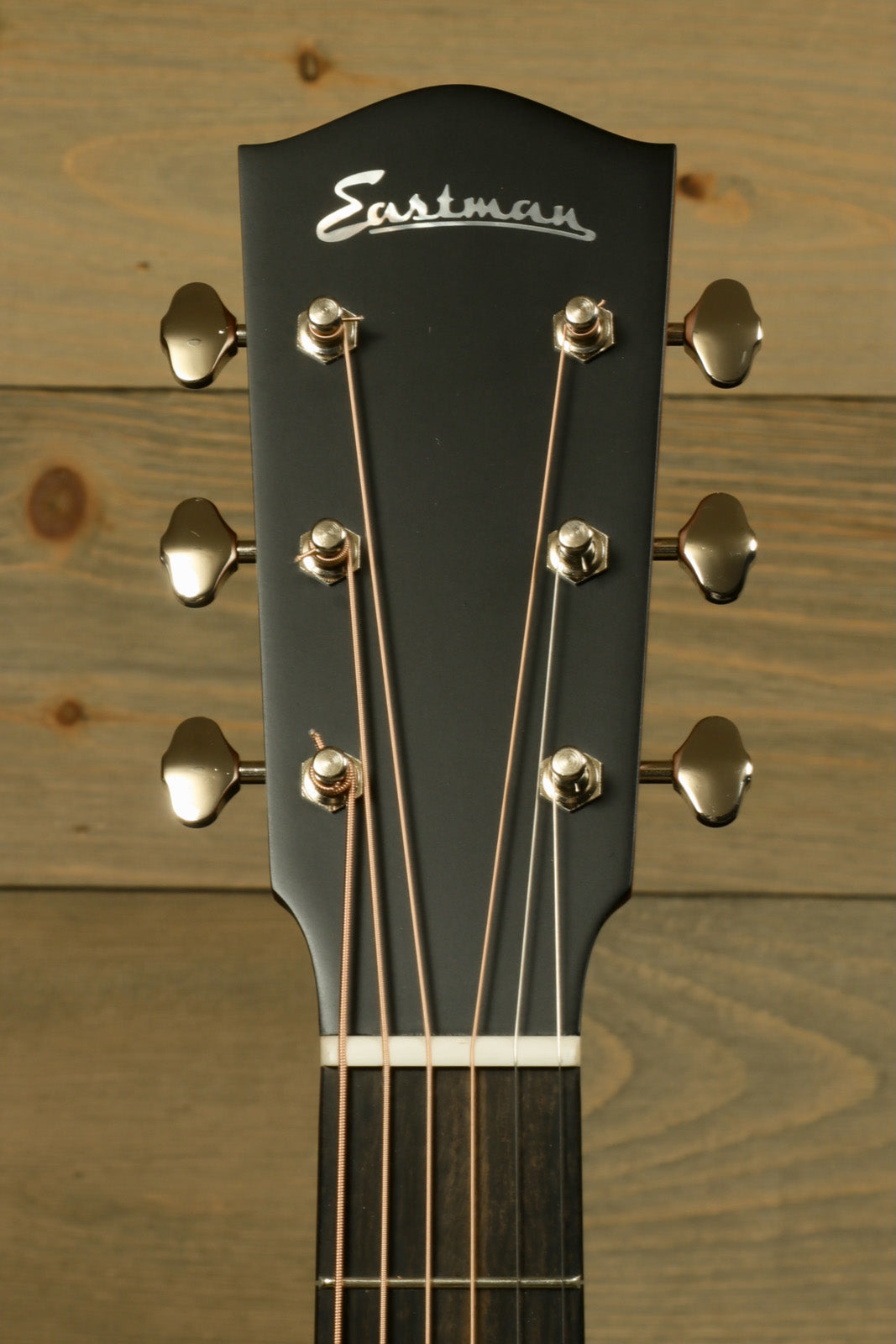 Eastman E10OOSS/v Classic Acoustic with Aged Look and Played In Feel headstock showcasing tuning pegs