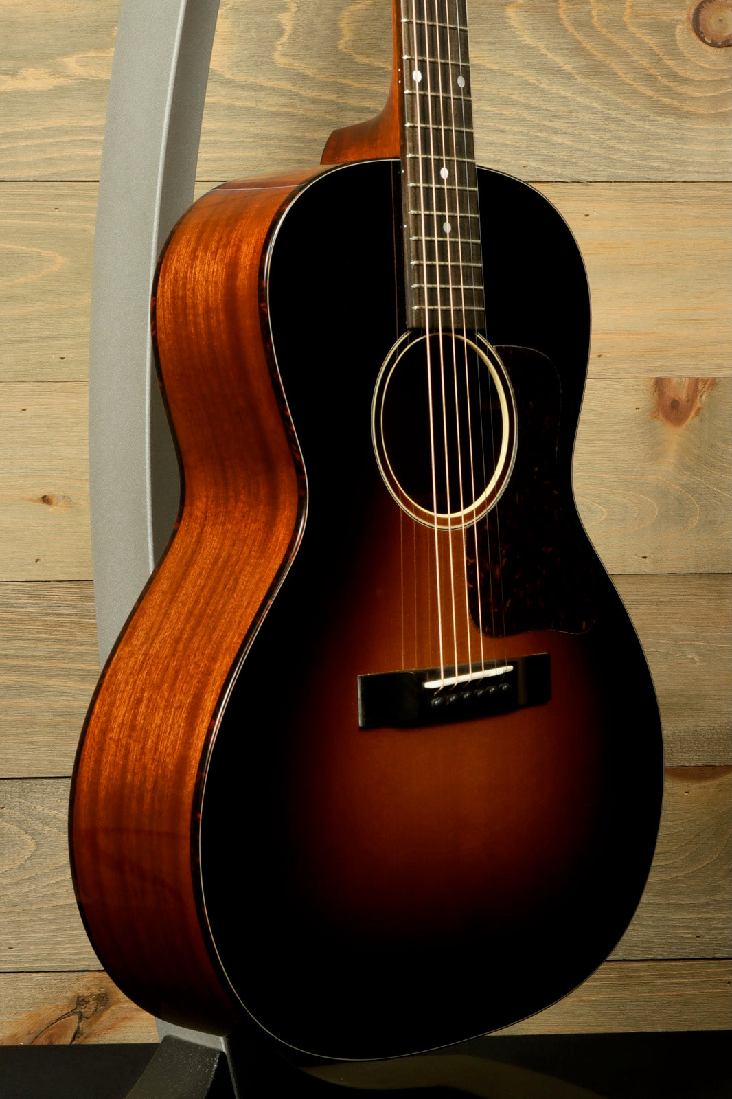 Eastman E1OOSS-DLX-SB acoustic guitar in sunburst finish, front view showcasing design