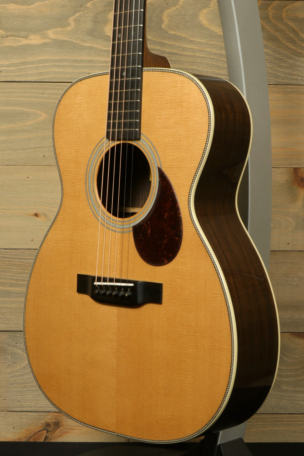 Eastman E8OM-TC acoustic guitar with a natural finish and elegant craftsmanship