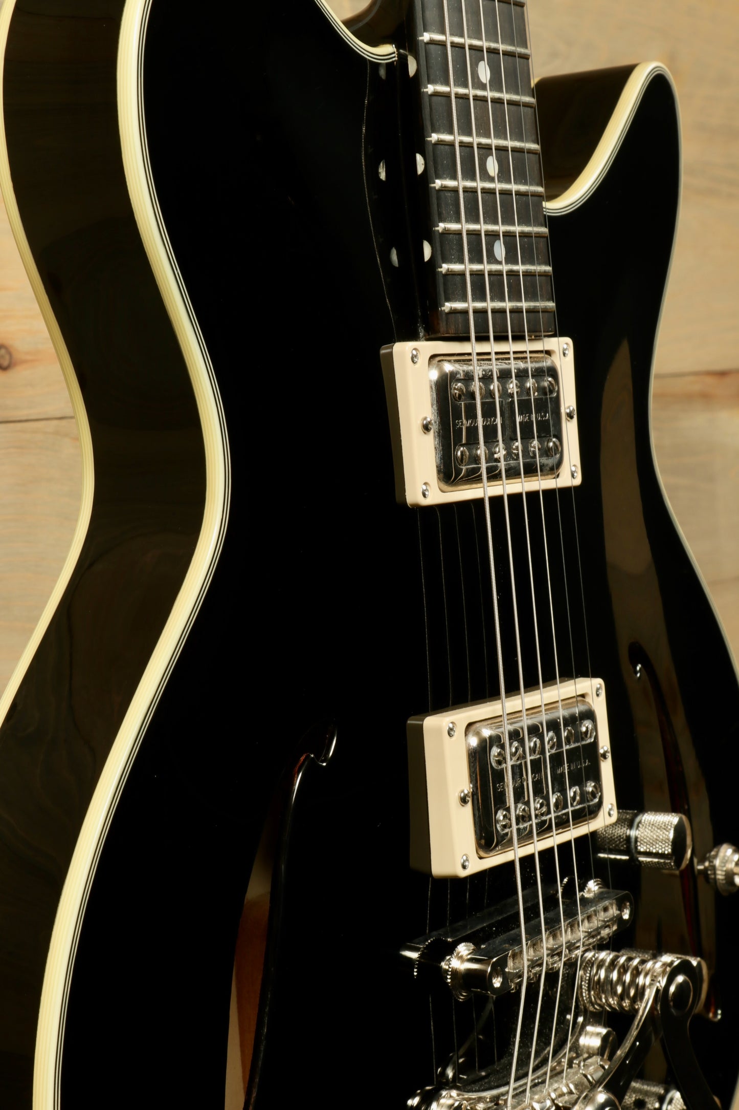 Eastman Electric Guitar with Hardshell Case, Black Finish - USED, side view showcasing its sleek design