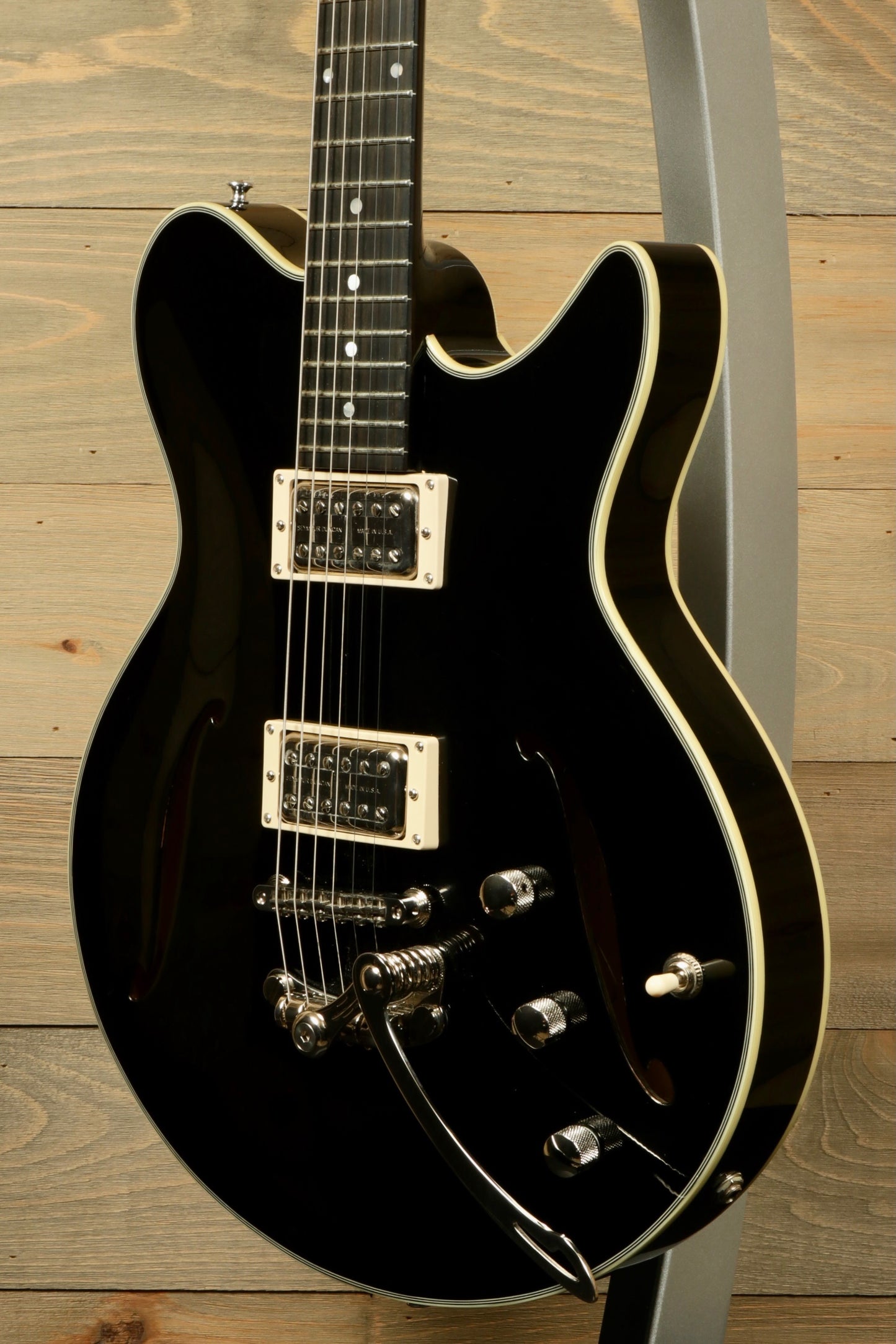 Eastman Electric Guitar with Hardshell Case, Black Finish - USED, side view showing body and pickups