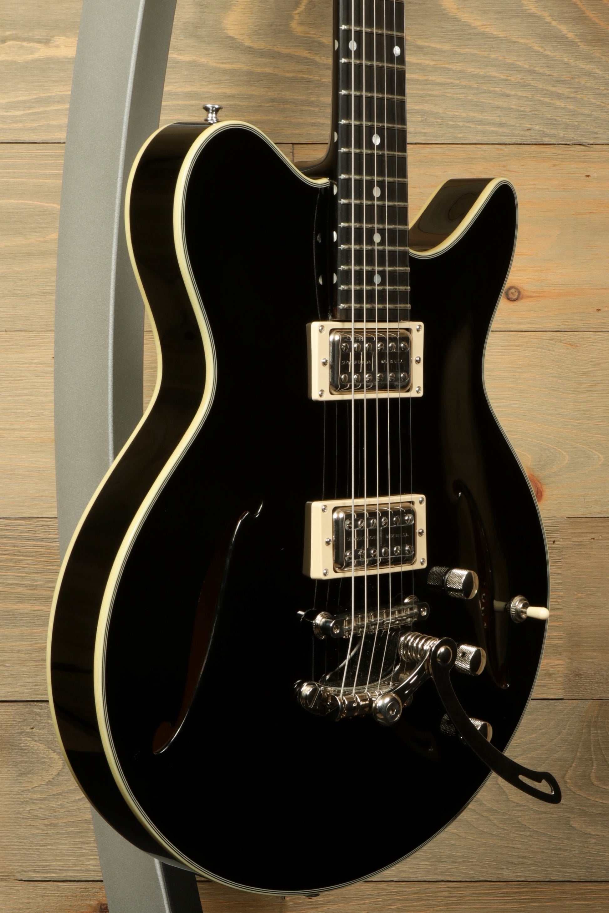 Eastman Electric Guitar with Hardshell Case, Black Finish - USED, angled view highlighting body and pickups