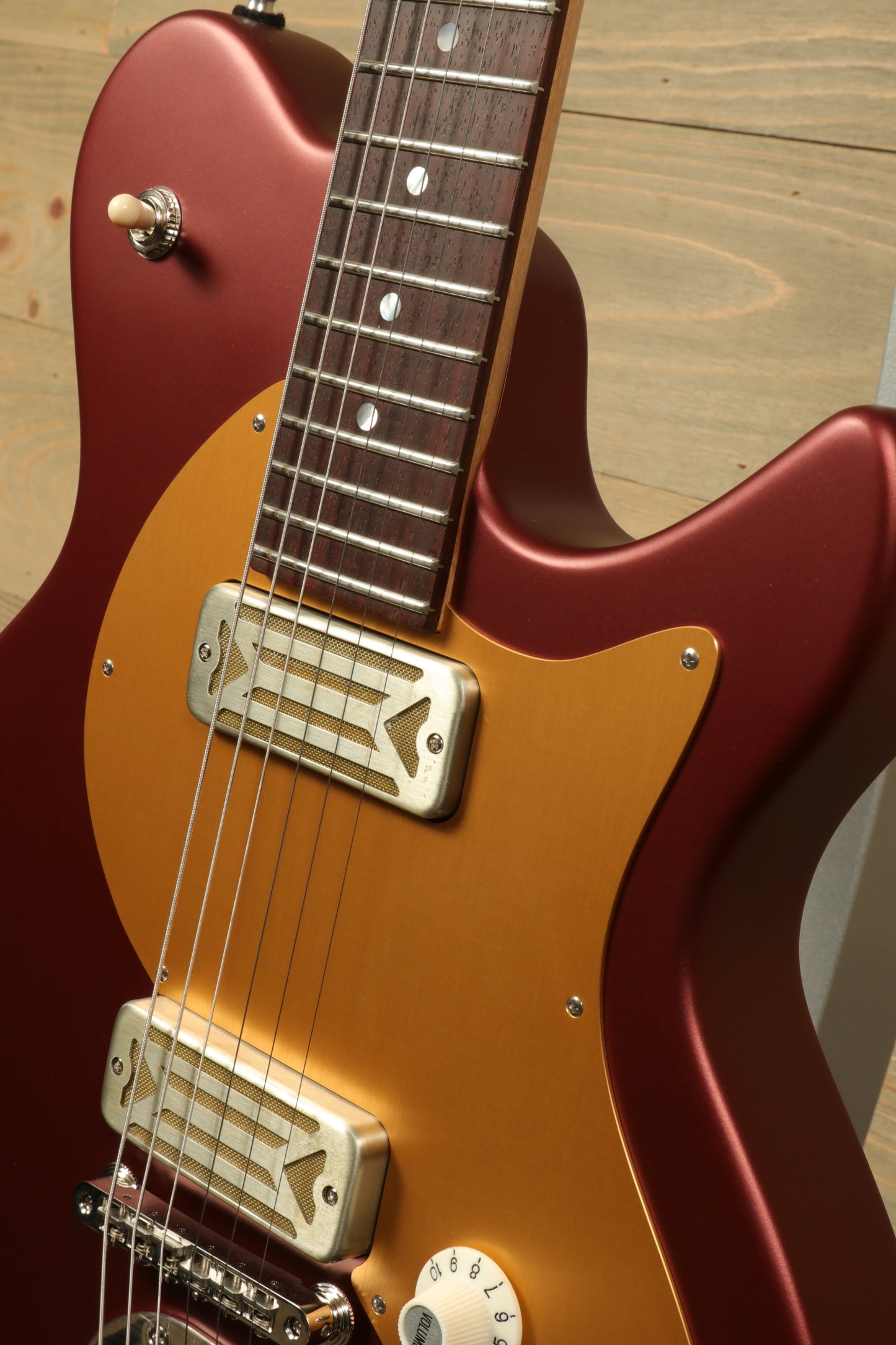 Eastman Fullertone Offset '62 with Vintage Red Finish, angled view showcasing fretboard and pickups