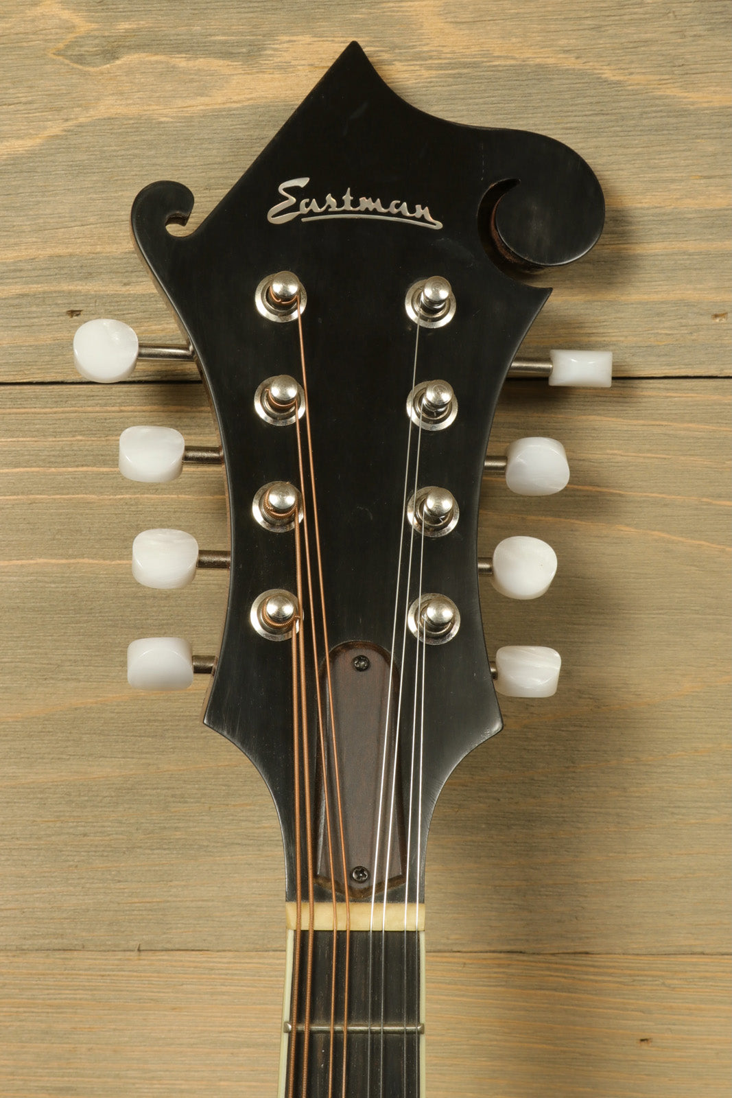 Eastman MD515/v mandolin headstock with pearl tuning knobs, front view - USED.