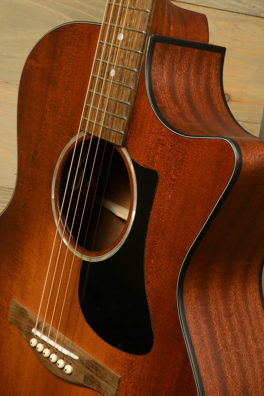 Eastman PCH1-GACE-CLA acoustic electric guitar in natural finish, close-up view of body and neck