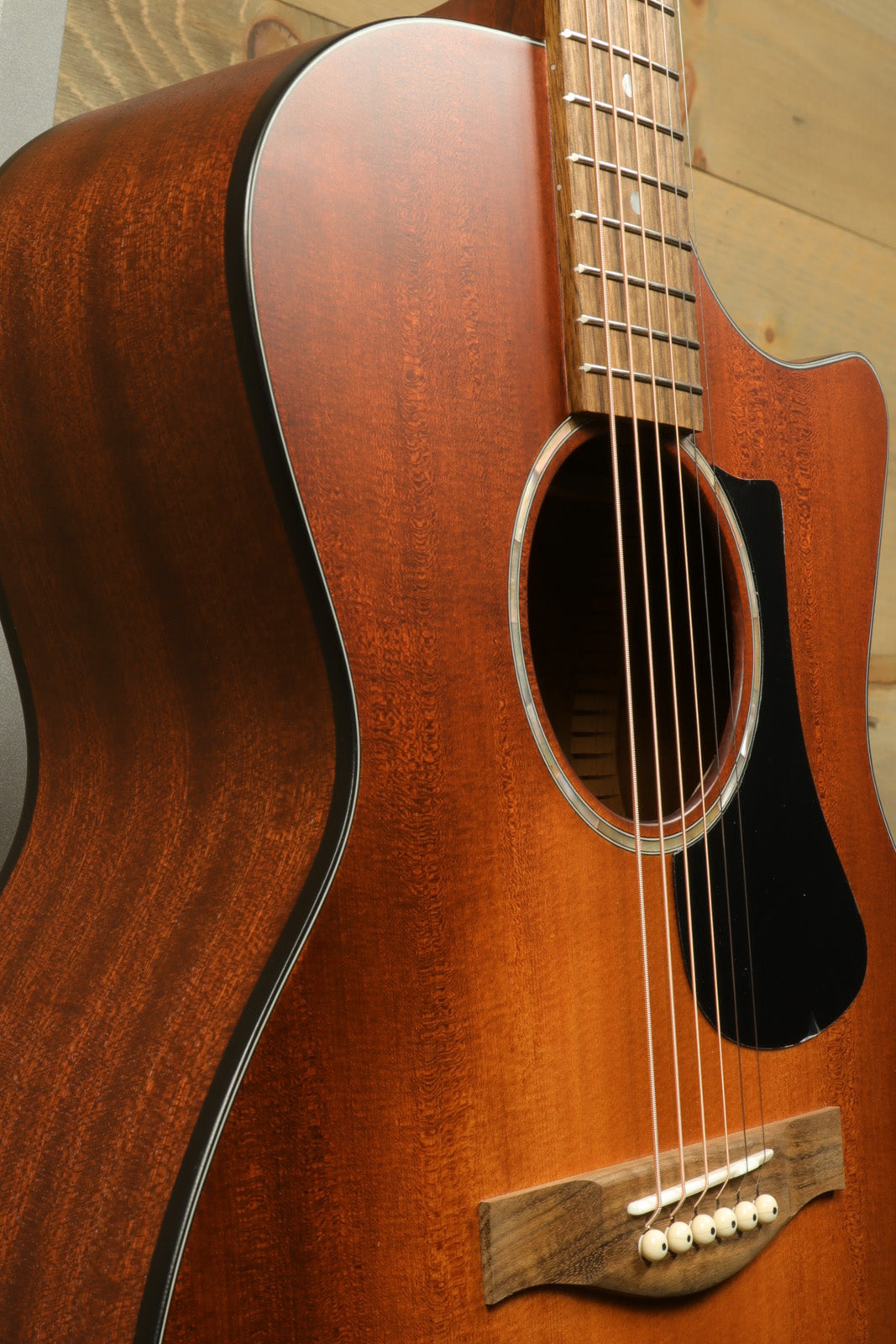 Eastman PCH1-GACE-CLA acoustic electric guitar in natural finish, front view showcasing body and soundhole