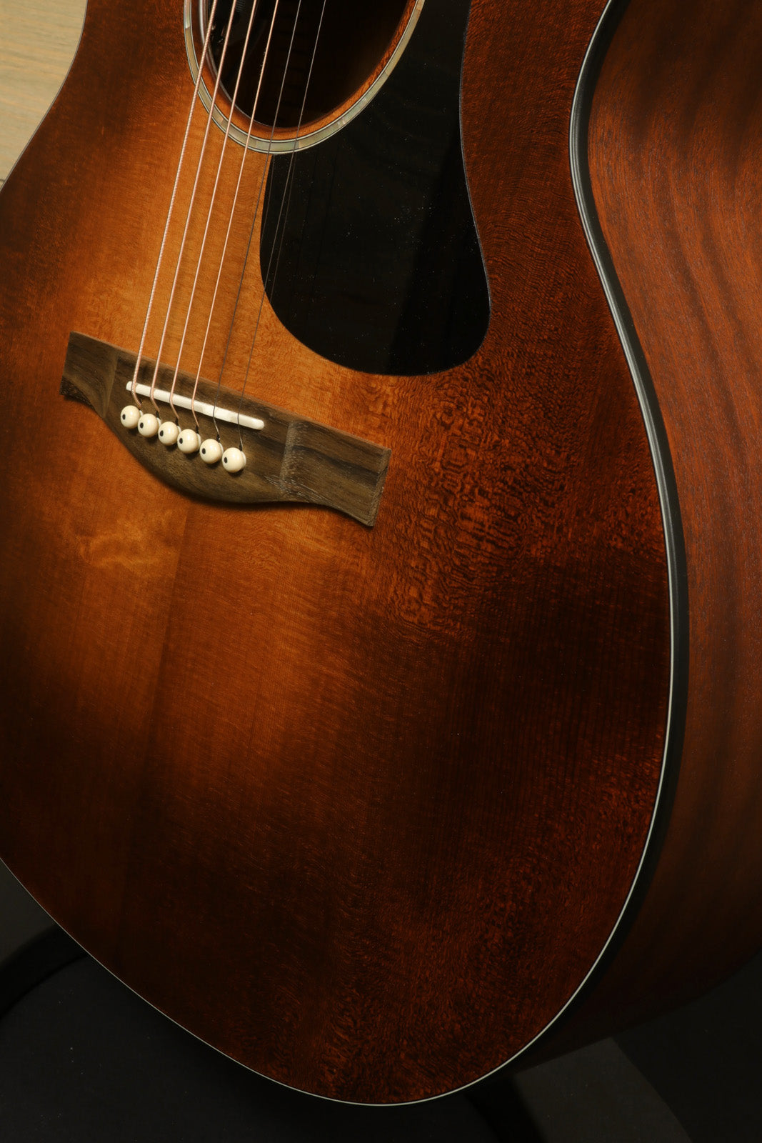 Close-up of Eastman PCH1-GACE-CLA Acoustic Electric Guitar showcasing its rich wood grain and craftsmanship