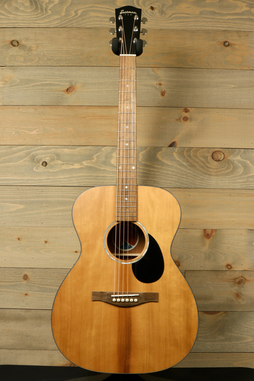 Eastman PCH1-OM natural finish acoustic guitar, front view with a classic Dreadnought shape