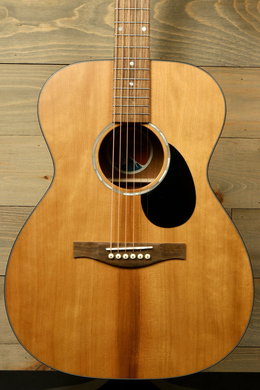 Eastman PCH1-OM acoustic guitar, natural finish, front view showcasing body and strings