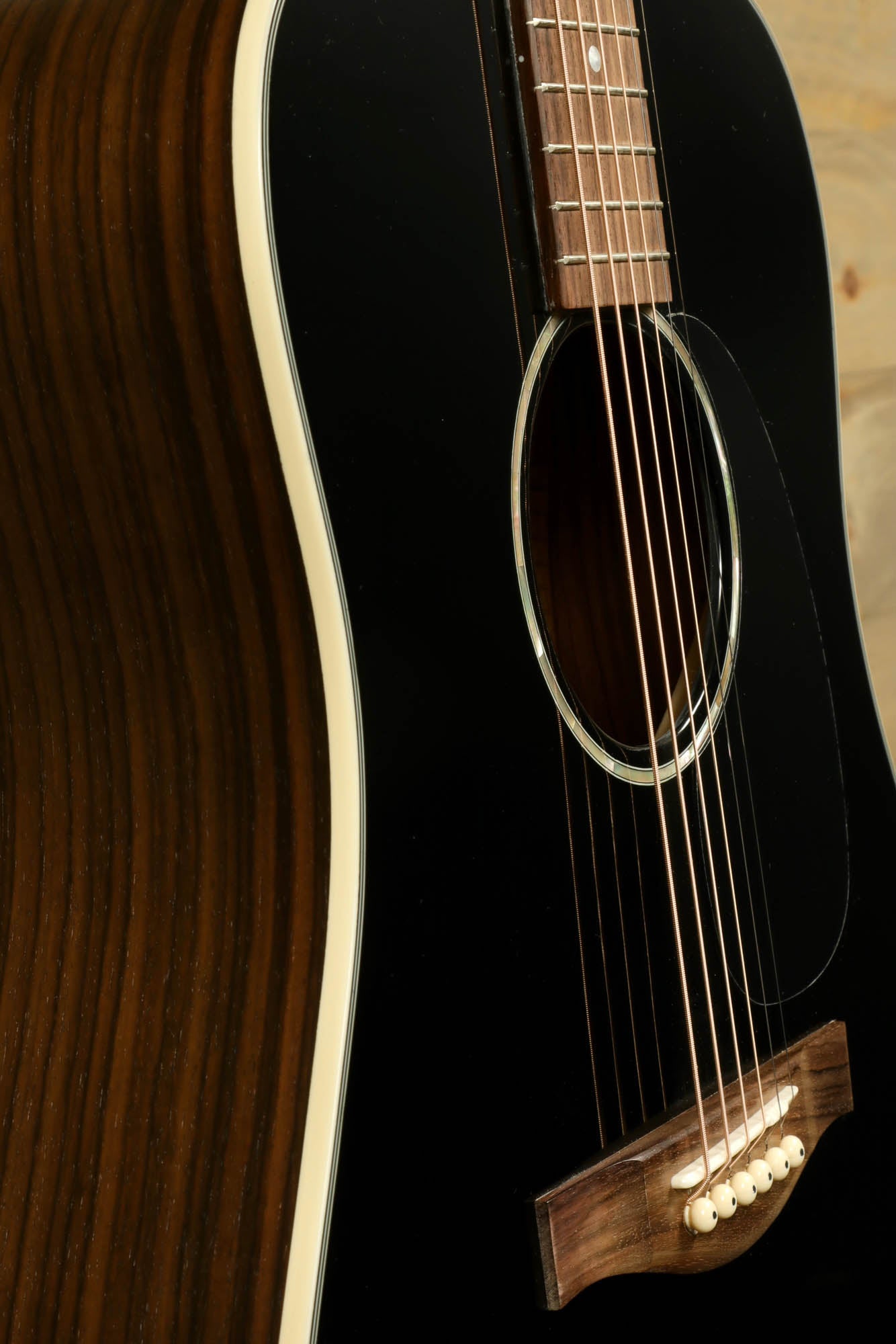 Eastman PCH2-D-BK acoustic guitar with a sleek black finish and rosewood details.