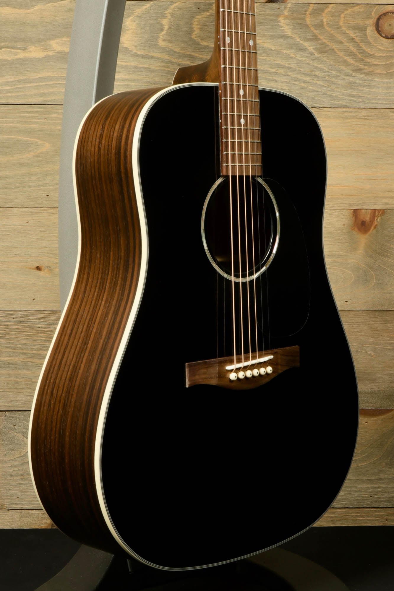 Eastman PCH2-D-BK acoustic guitar featuring a sleek black finish and detailed wood grain