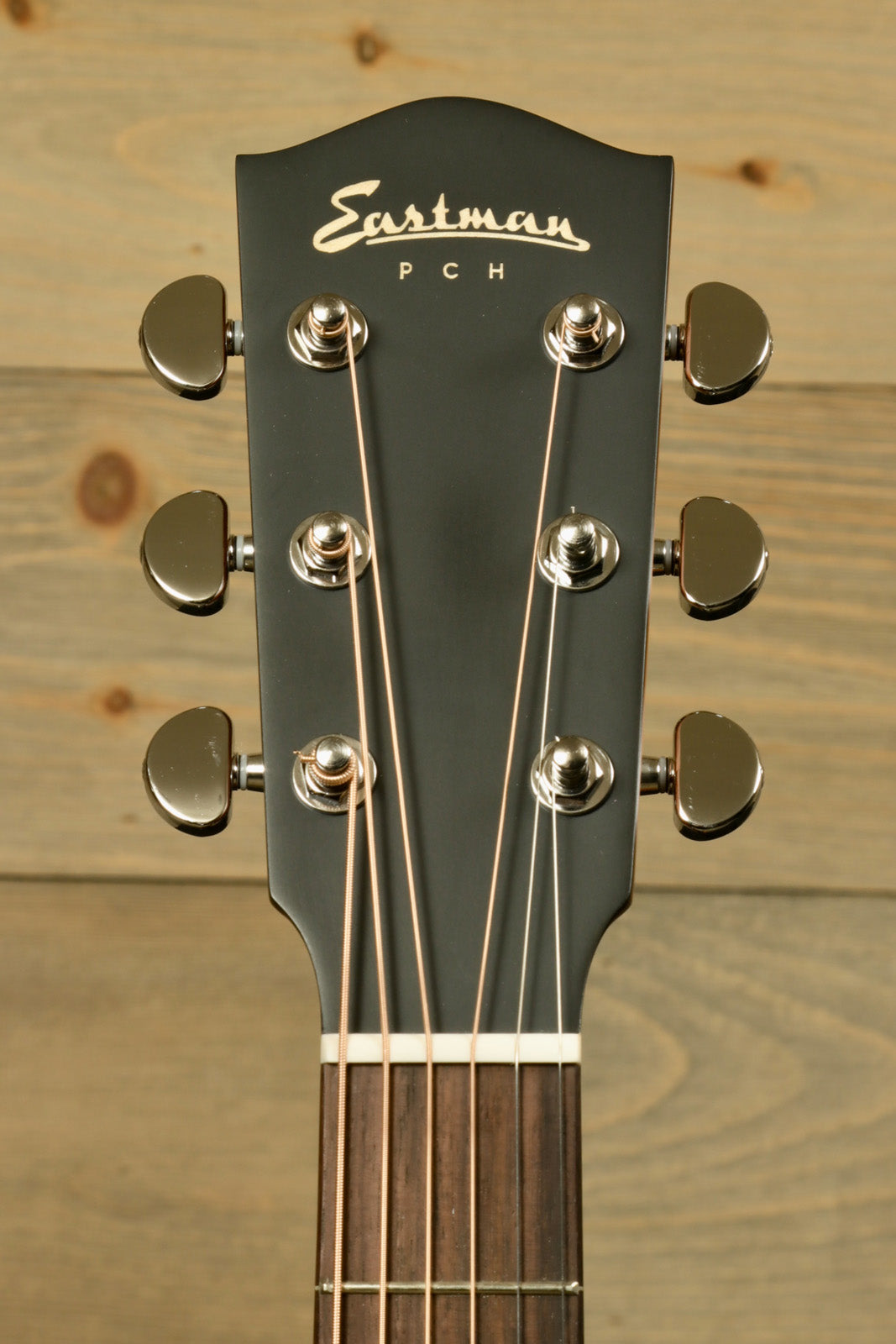 Eastman PCH3-GACE Amberburst Acoustic Guitar headstock with tuning pegs, front view