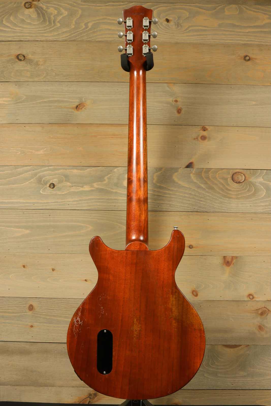 Eastman SB55DC/v electric guitar in natural mahogany finish, back view showcasing its sleek design