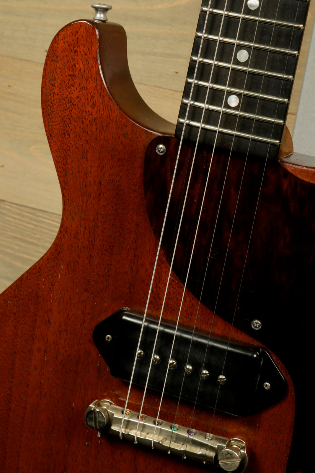 Eastman SB55DC/v electric guitar in natural finish, close-up view of body and neck
